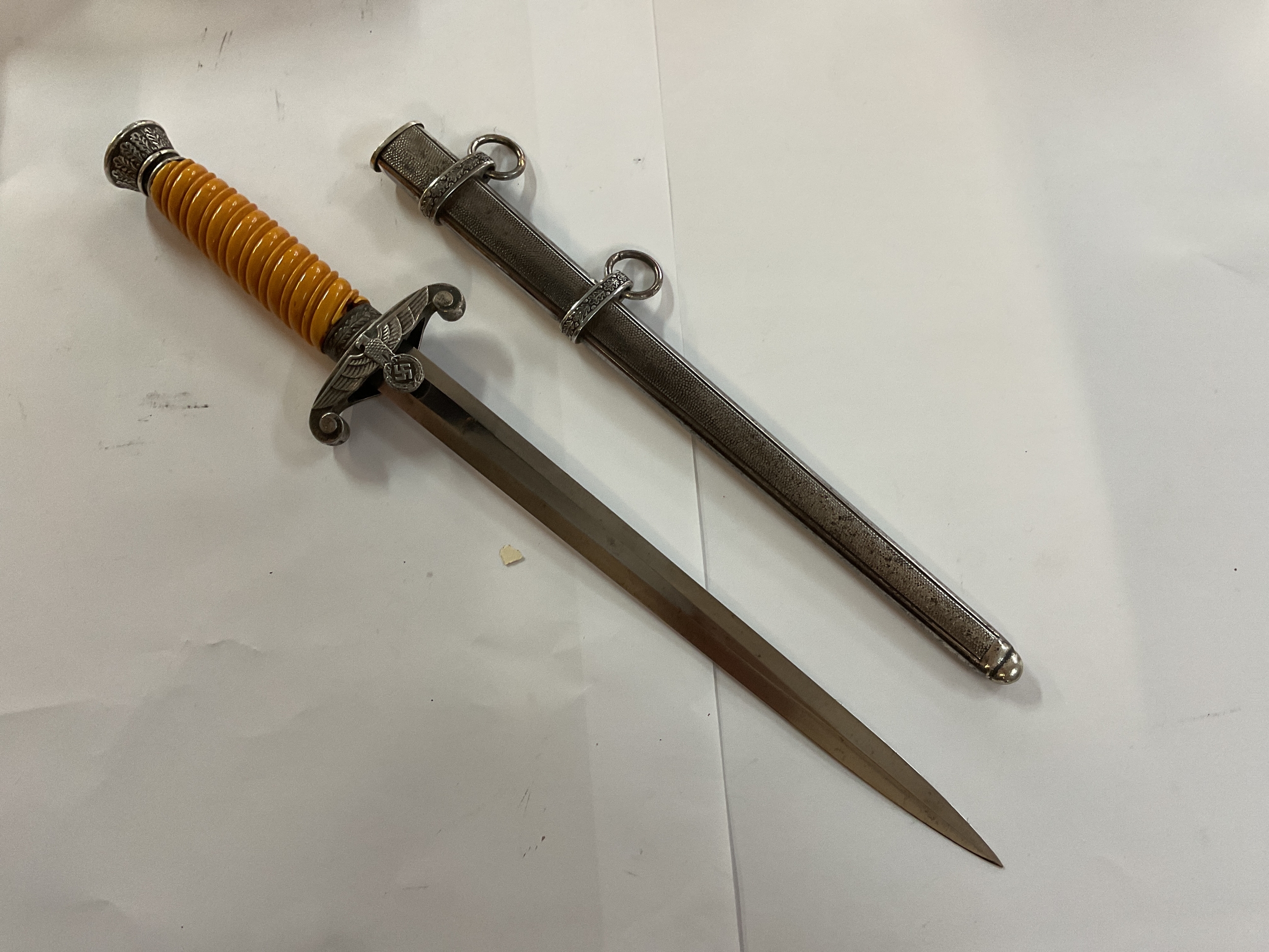 WWII German Army dress dagger with yellow grip.