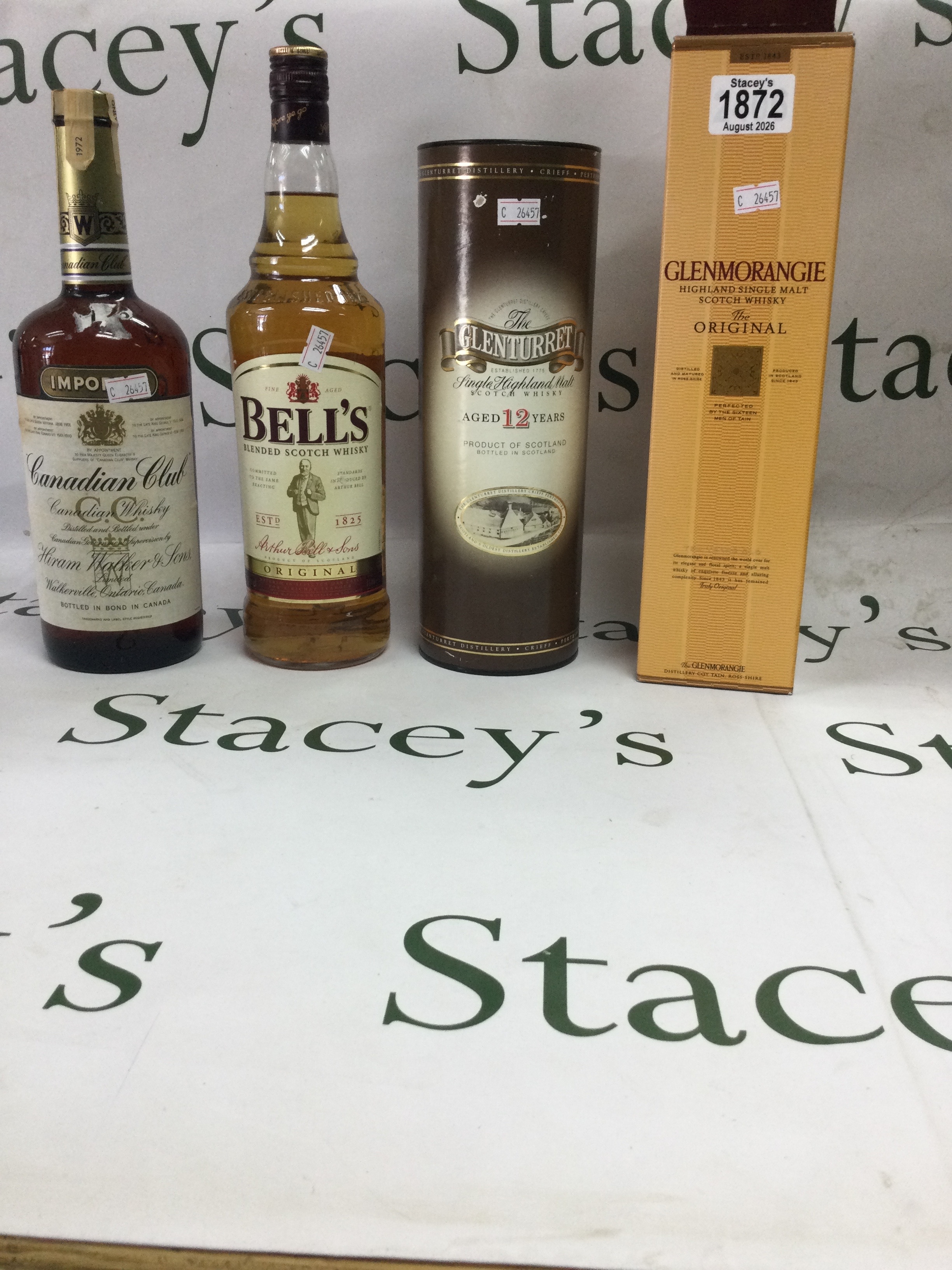 Mixed collection of whiskeys, including,The glenturret 12 year old - single highland malt scotch whisky,,with original presentation tube. Canadian club - vintage Hiram walker blended Canadian whisky, bottled in bond. Bells original- blended scotch whiskey. Glenmorangie the original - highland single malt scotch whisky, with original box.