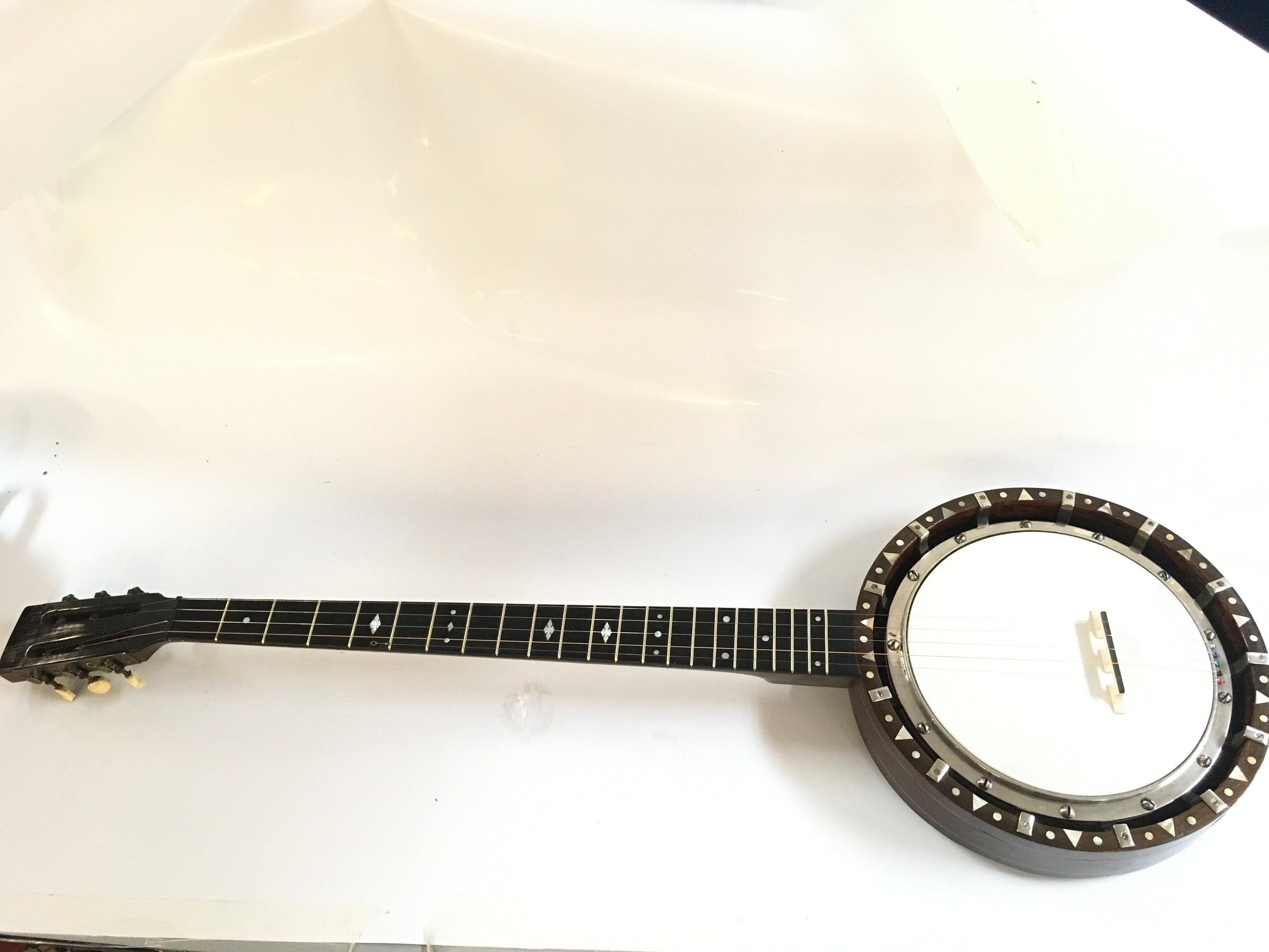 Cased Banjo. Approximately 90cm long