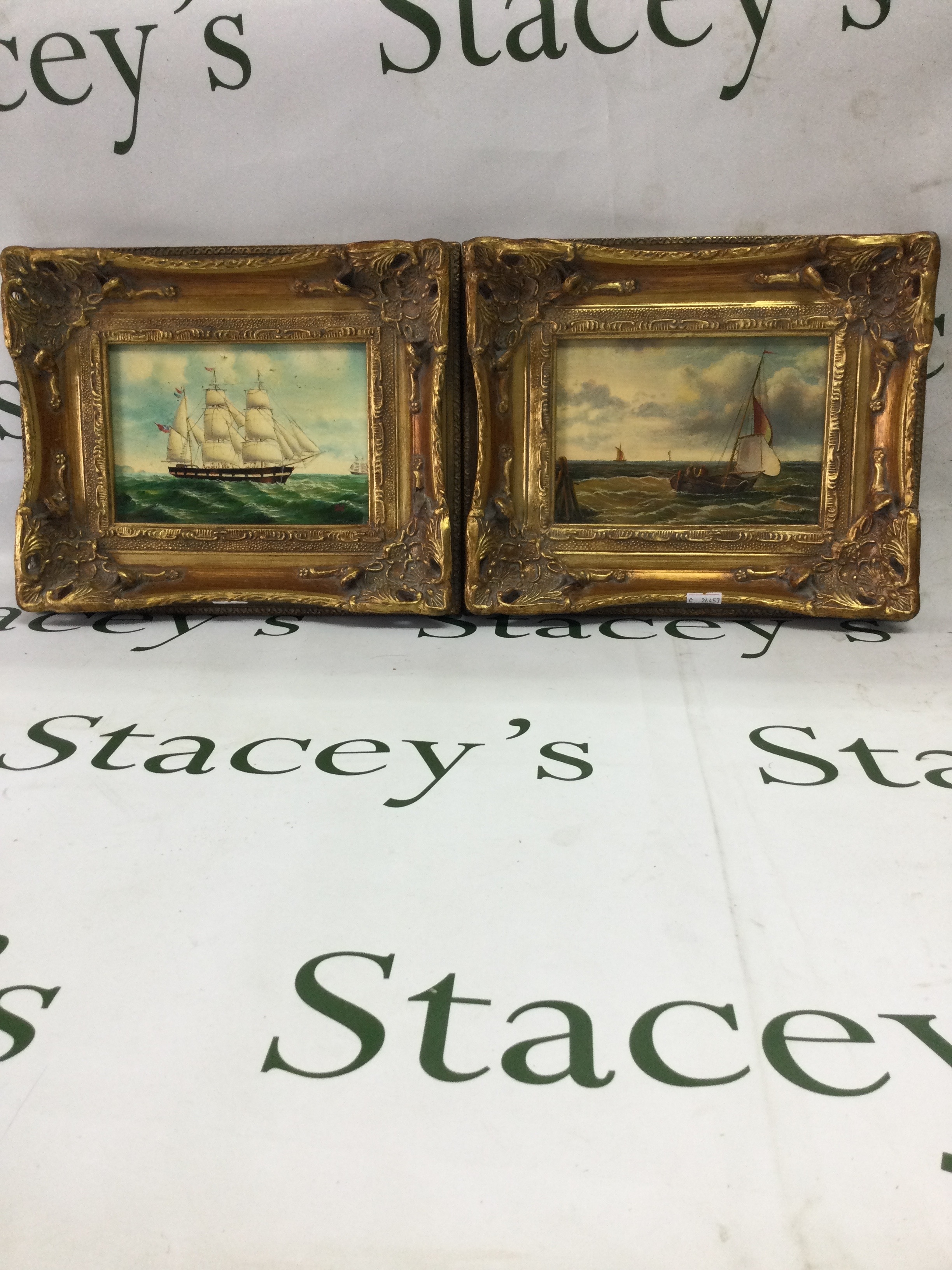 Pair of replica maritime oil paintings - gilt framed. Two matching decorative oil paintings on board, depicting classic marine scenes.