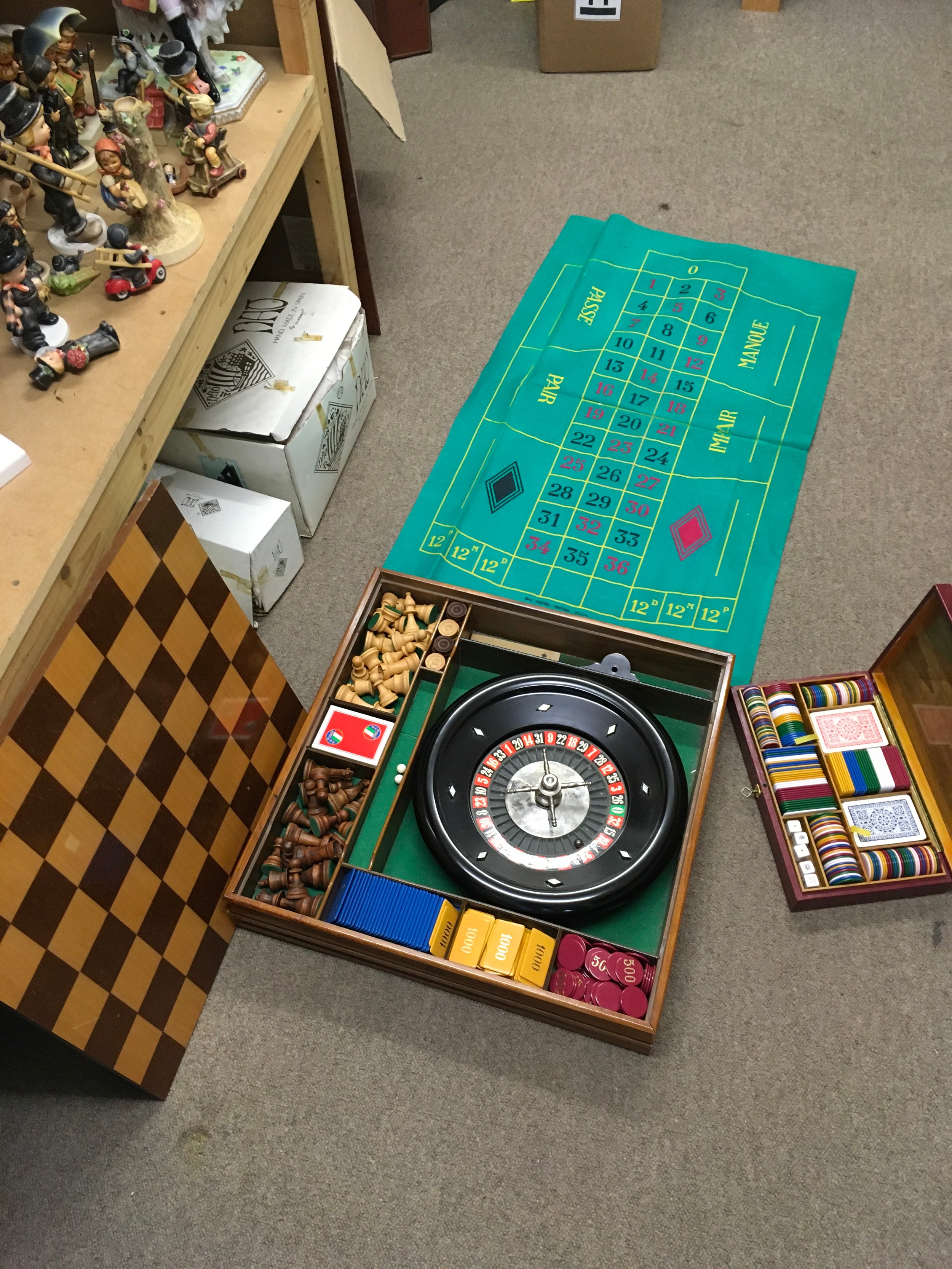 A luxury Italian games box by including a roulette wheel, chess pieces, cards etc