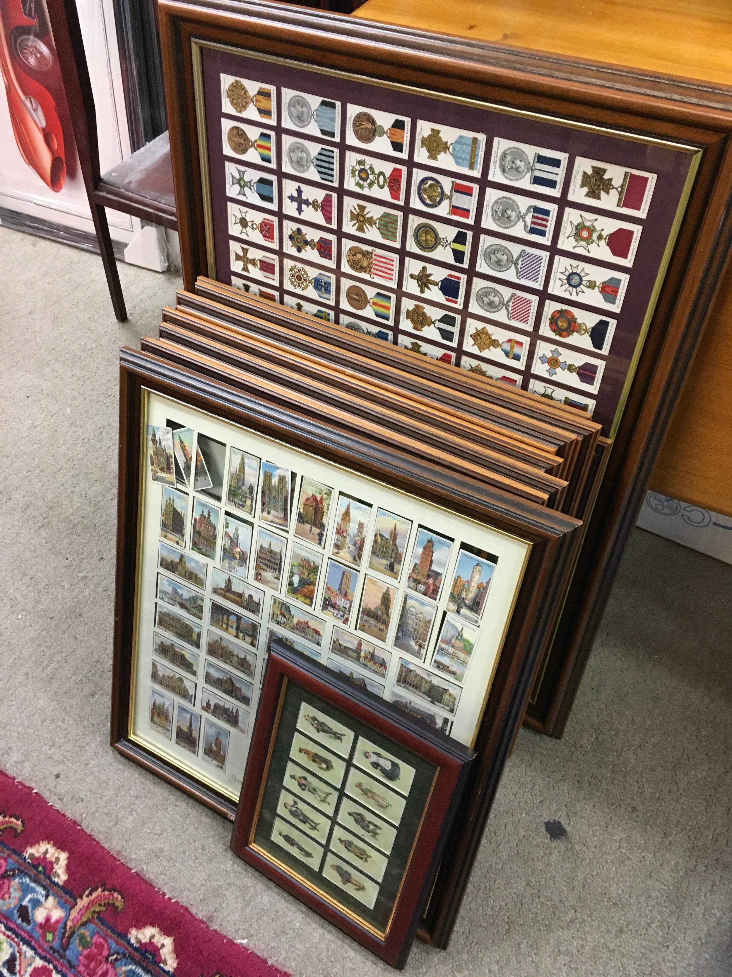 A large collection of Framed cigarette cards including Wills, Players