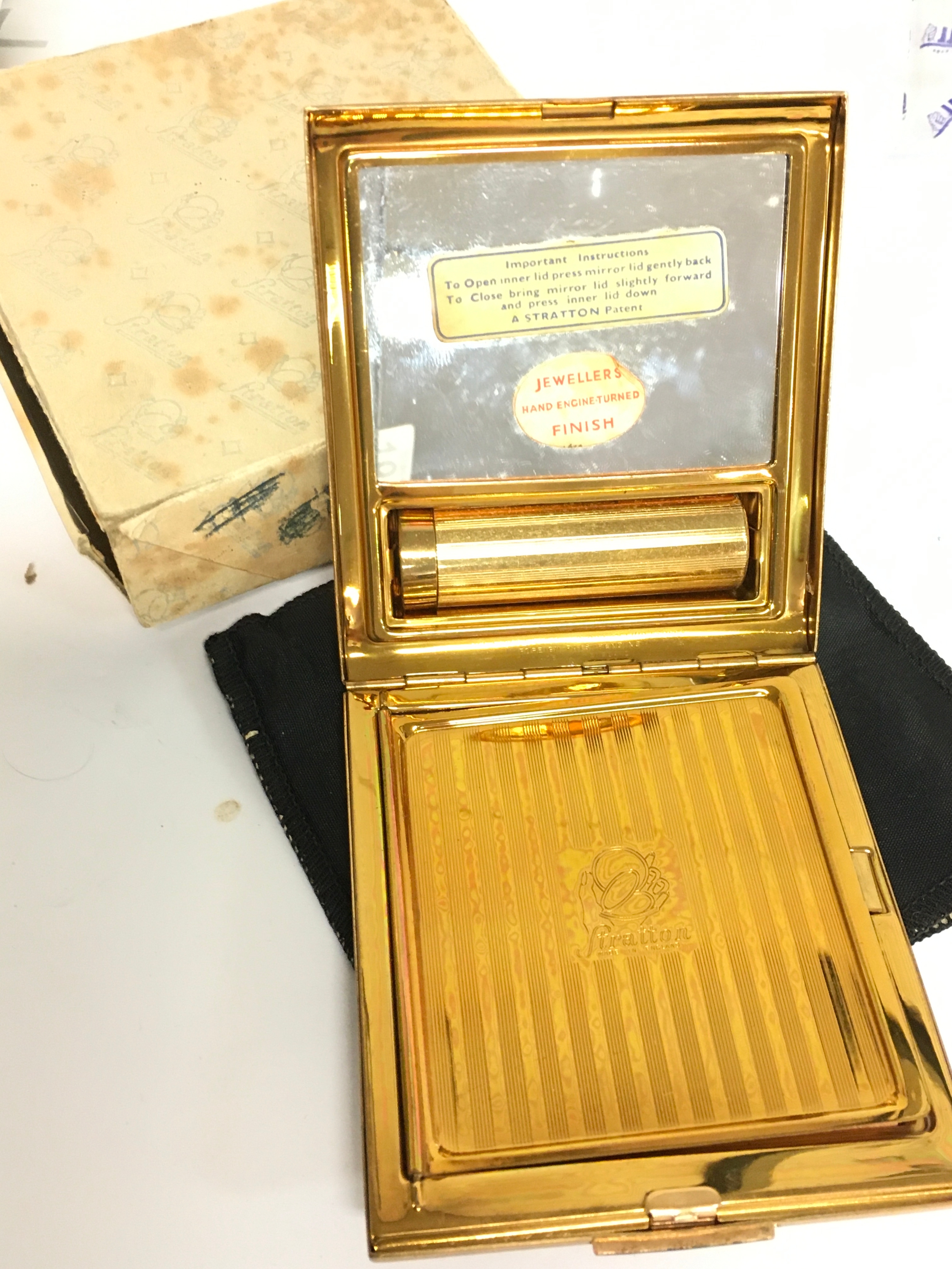 A Stratton compact in a case
