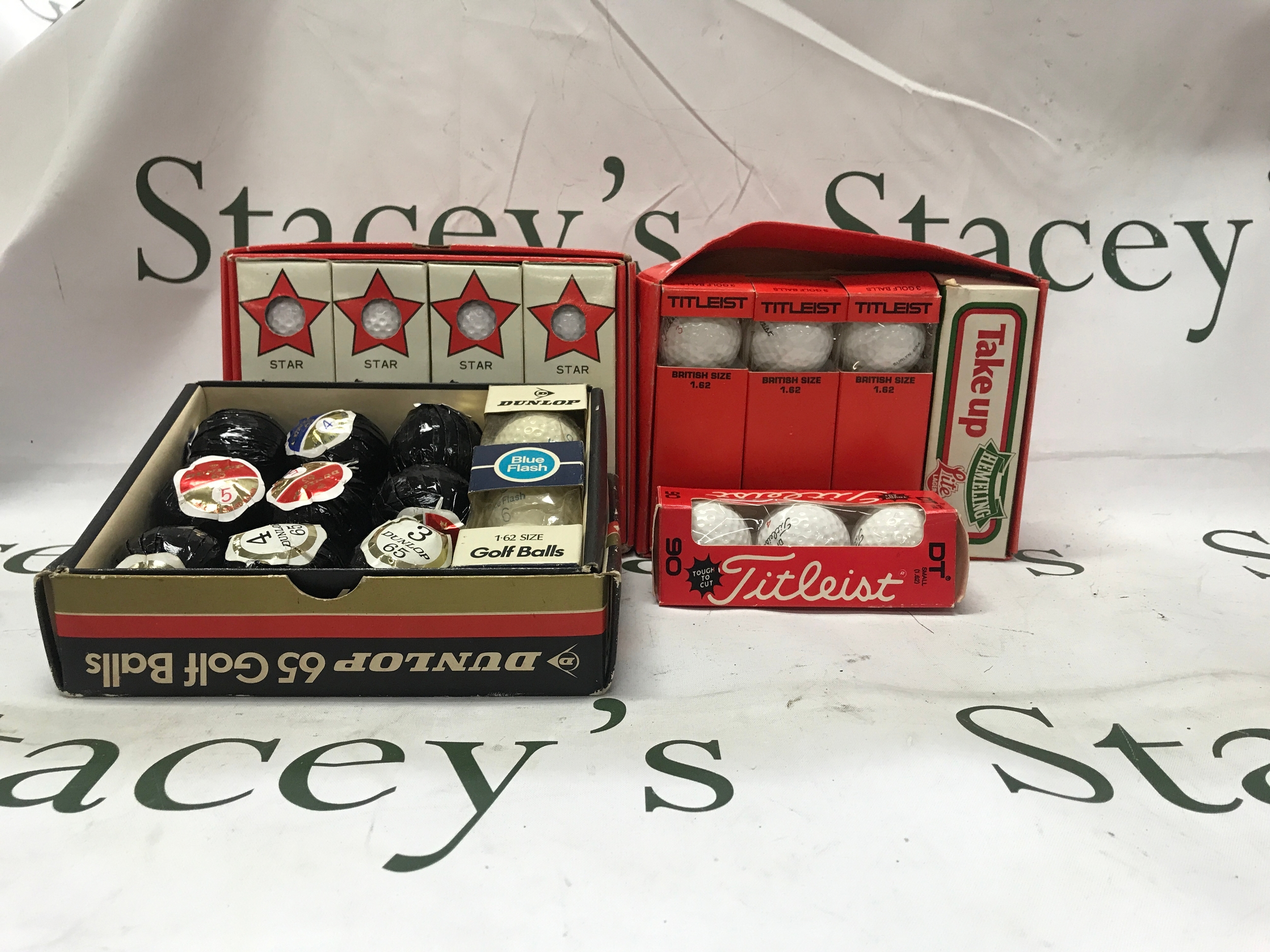 Mixed collection of loads of golf balls and games including luxury brands such as titleist, Dunlop, etc..
