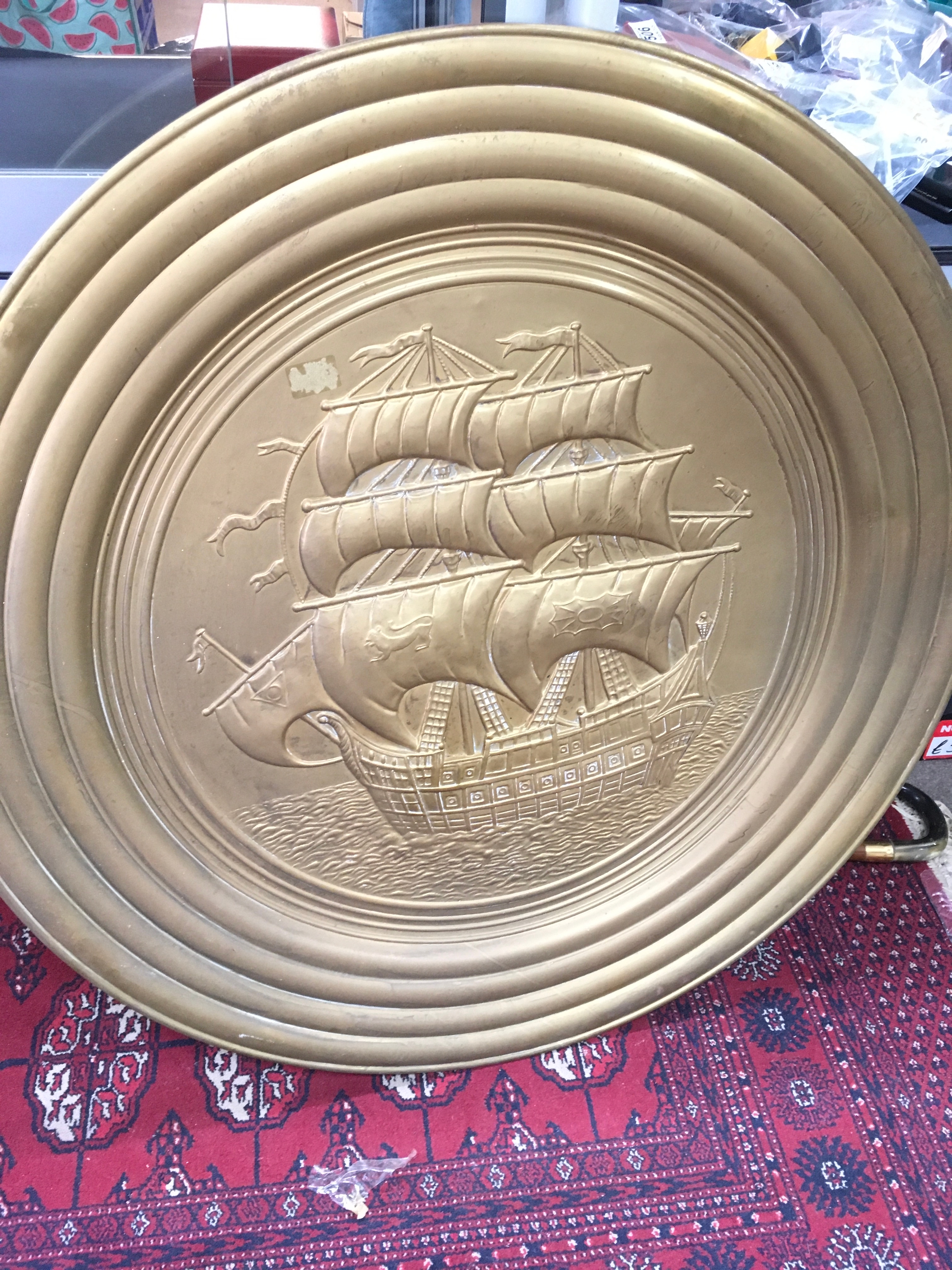 A substantial large oval brass decorative wall plate, mid 20th century, likely English continental manufacturr.