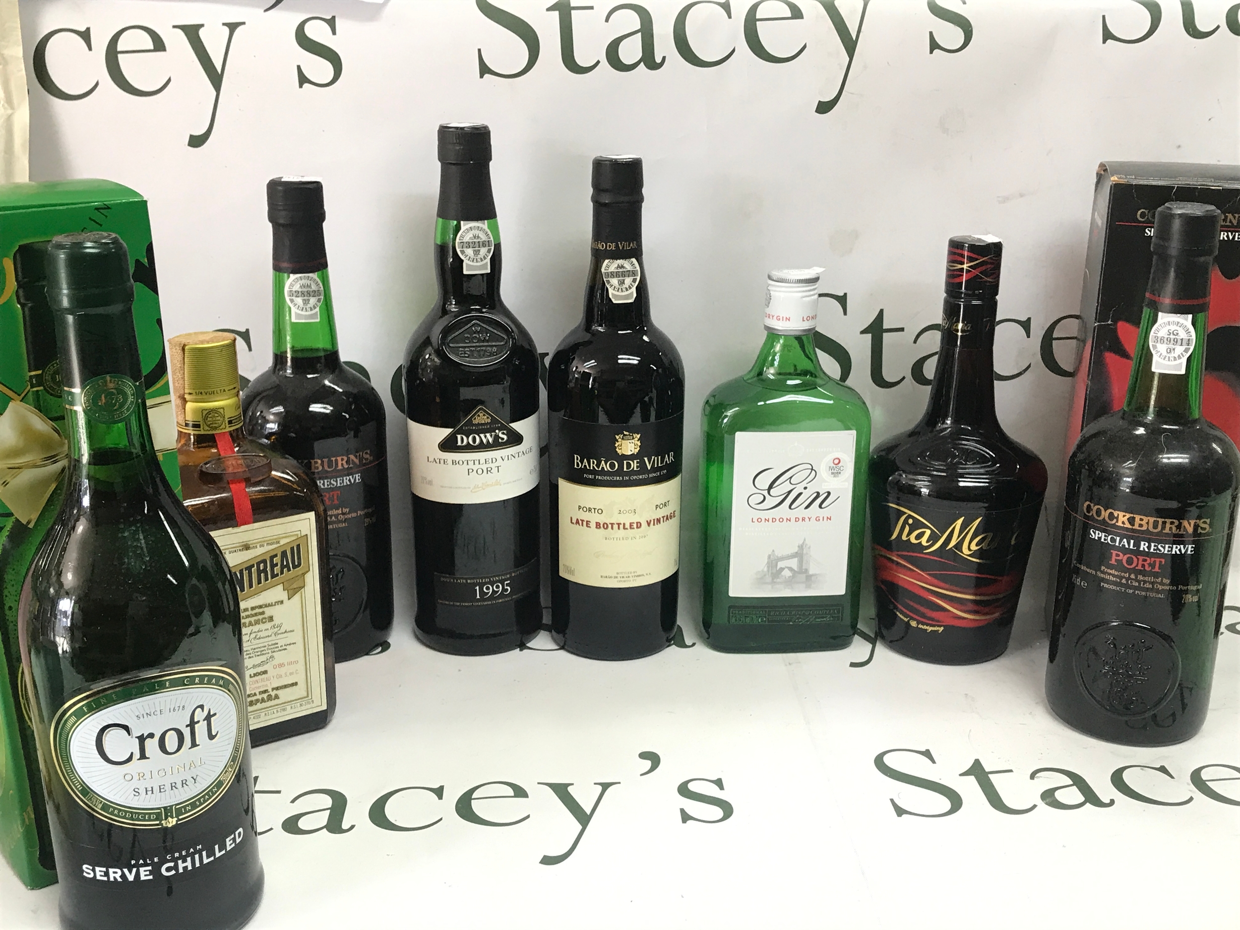 A Collection of spirits including Gin, Wine such as Cockburns, Dows, Tia Maria etc 