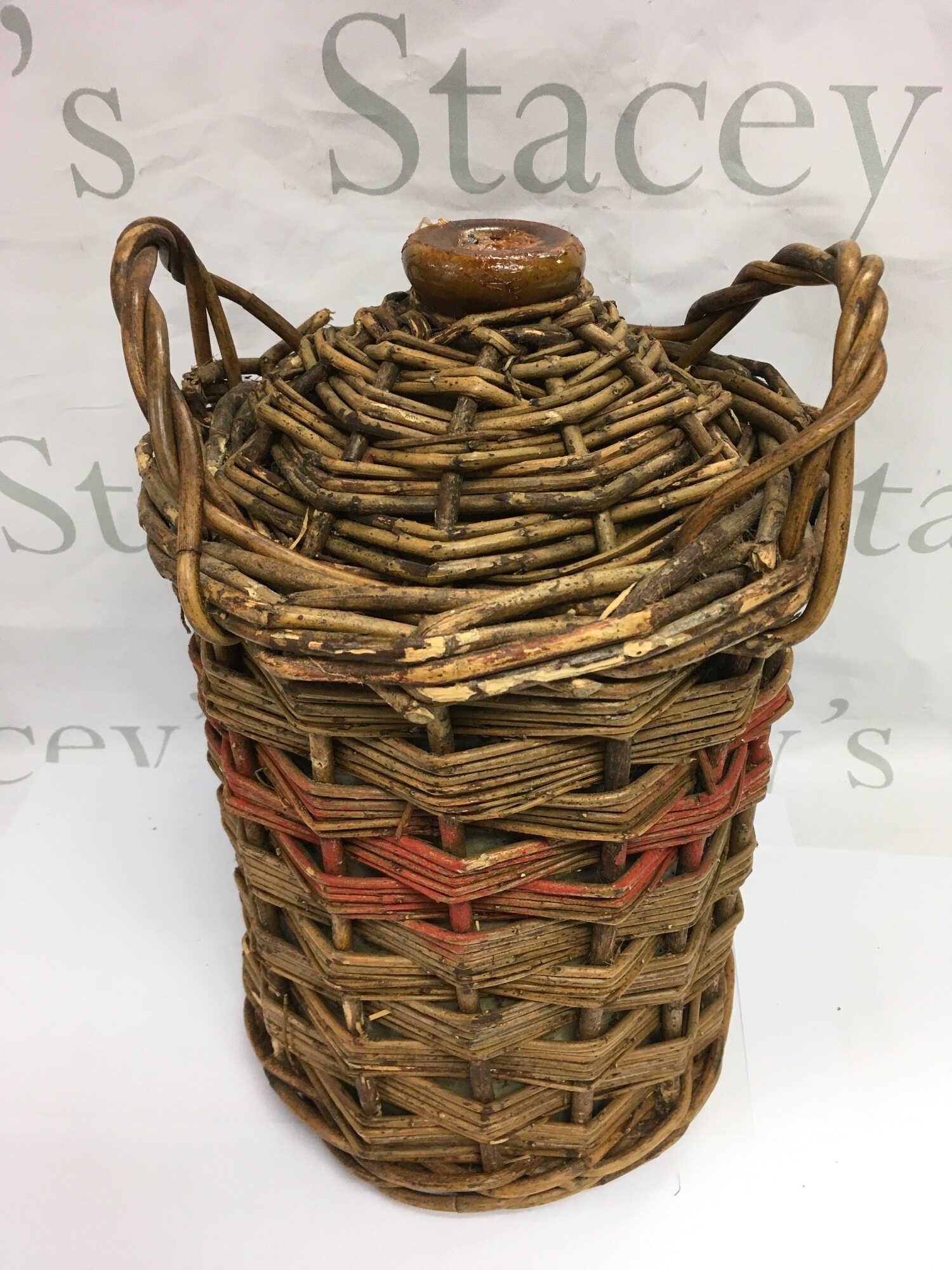 A vintage wicker Royal Navy rum tub and contents used for dispersing rum rations to the crew on board ship.
