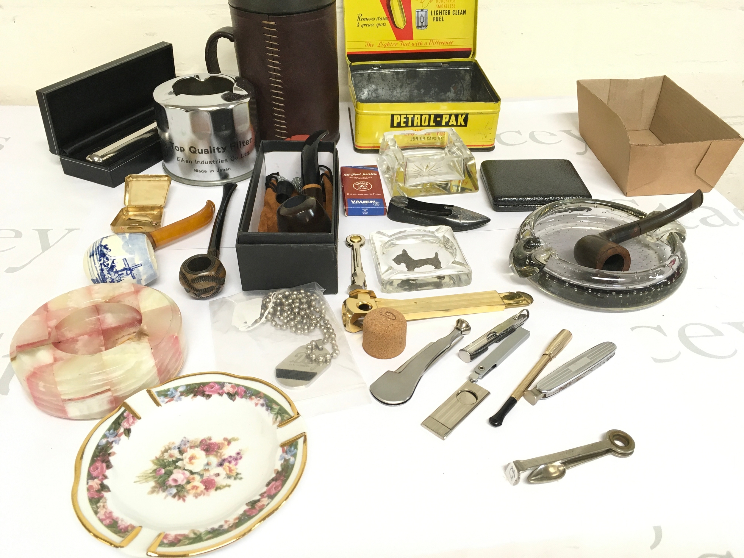 A collection of assorted smoking items/memorabilia including pipes, ashtrays, cutters etc.
