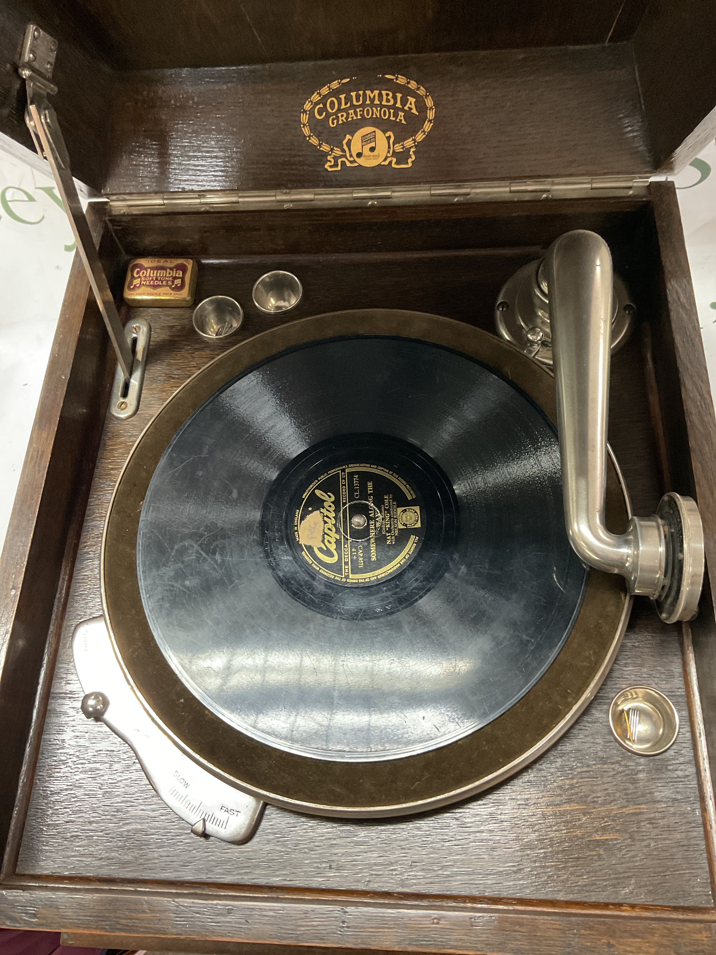 Columbia Grafonola gramophone. In oak case with opening shutters to the front for volume control,in good working order complete with records and pins in Columbia tin.