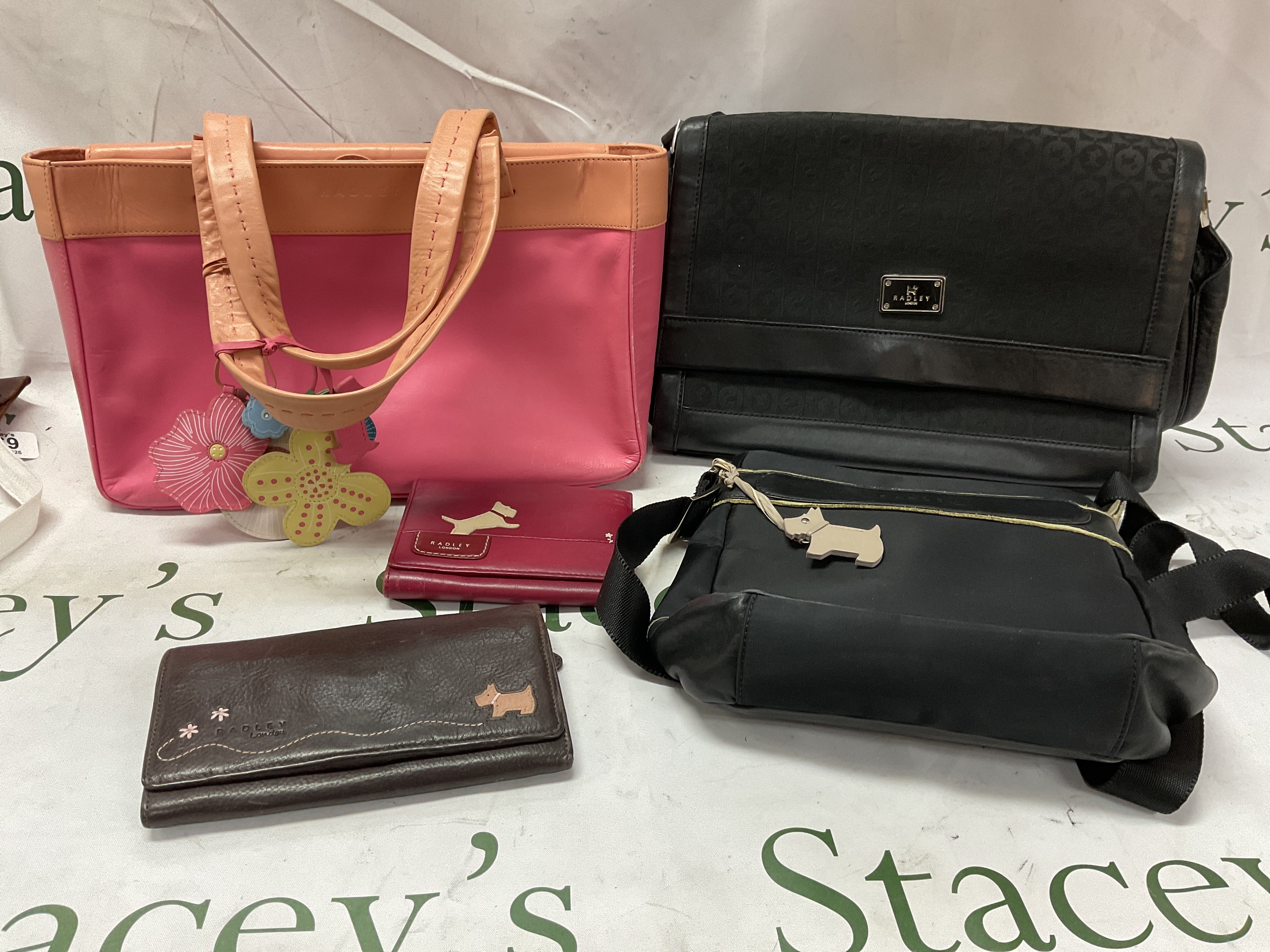 Collection of Radley bags and purses.