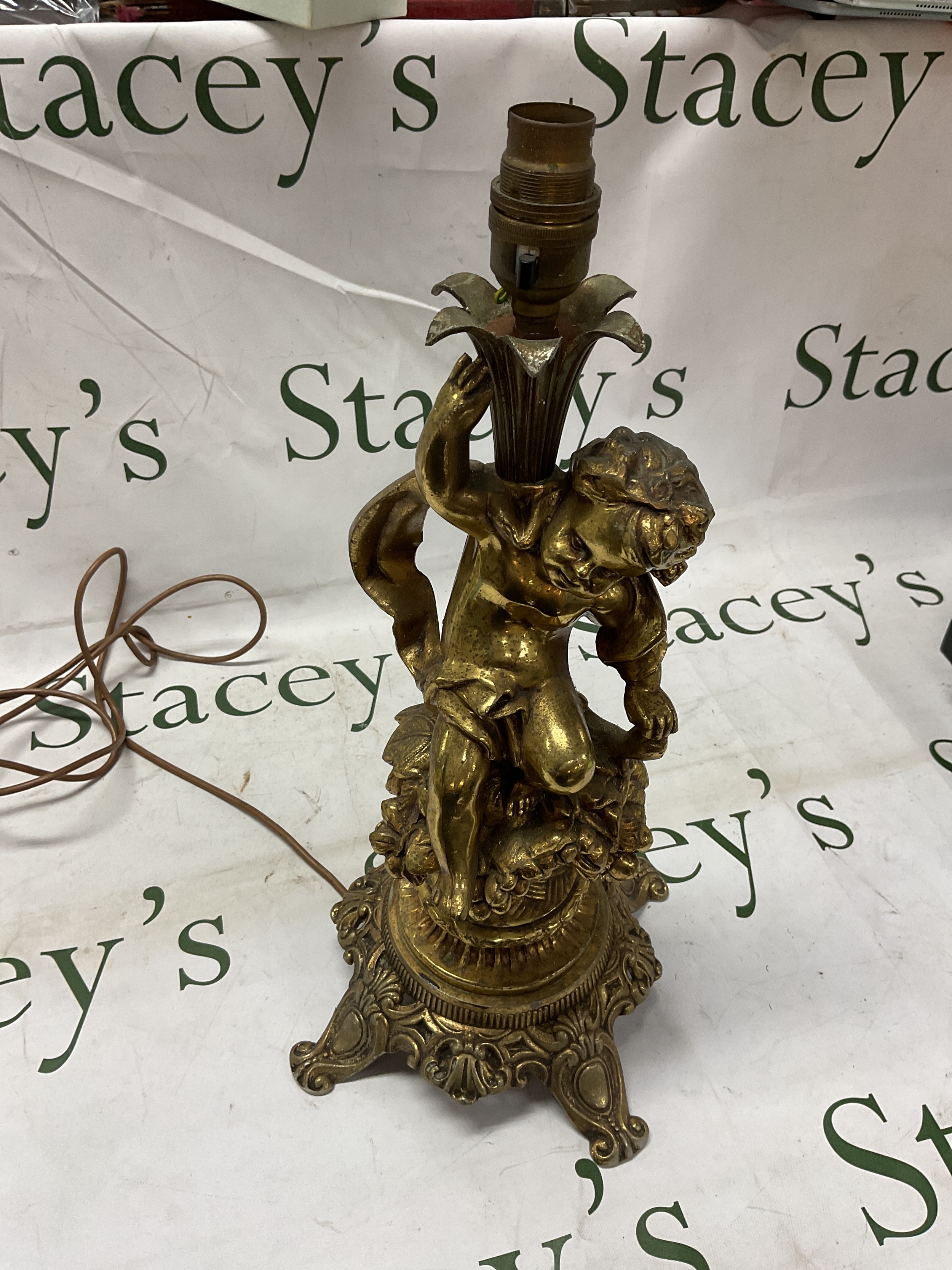 Large brass Putti on grapes and vines table lamp. 42 cm high.