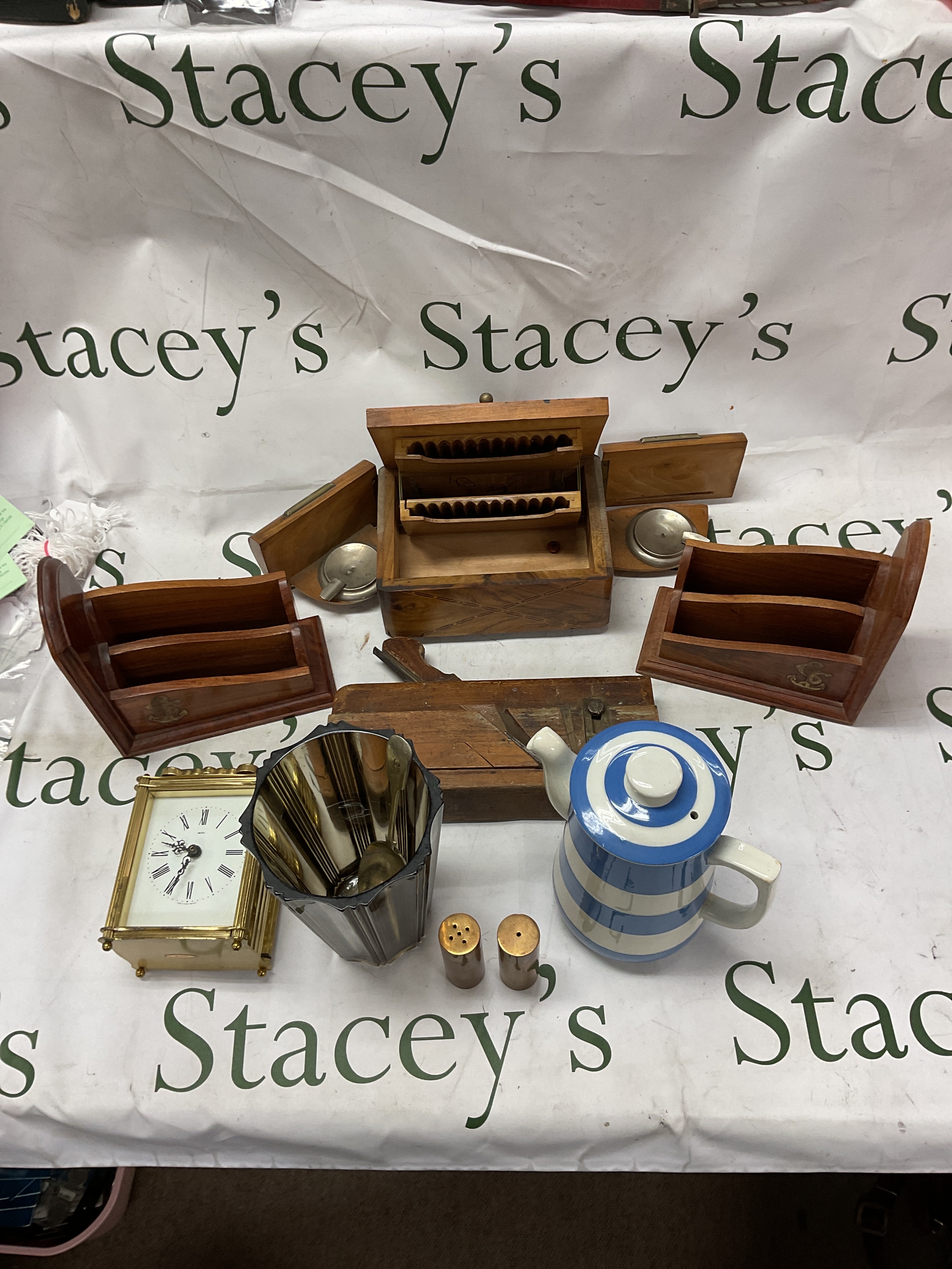 Musical cigarette dispenser a/f, pair of brass inlaid bookends, digital click, plane and brass cruet, along with vase and tea pot .