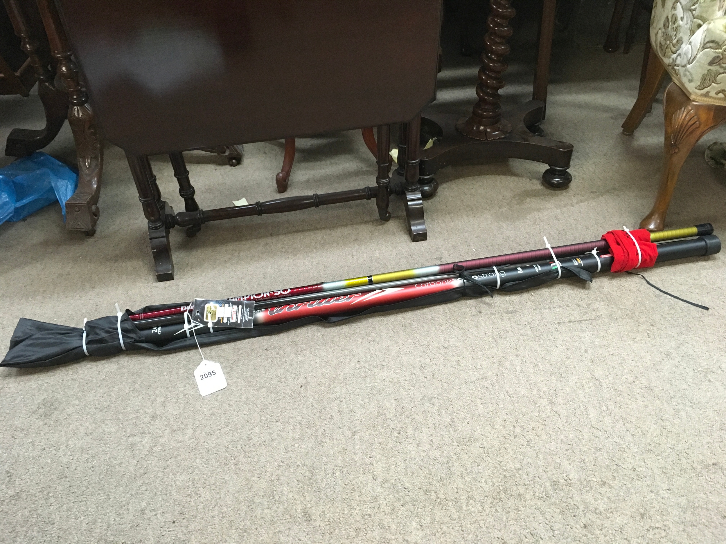 A Middy carp strong carbonex 8H pole, looks to be unused and a new Daiwa champion 50 whip