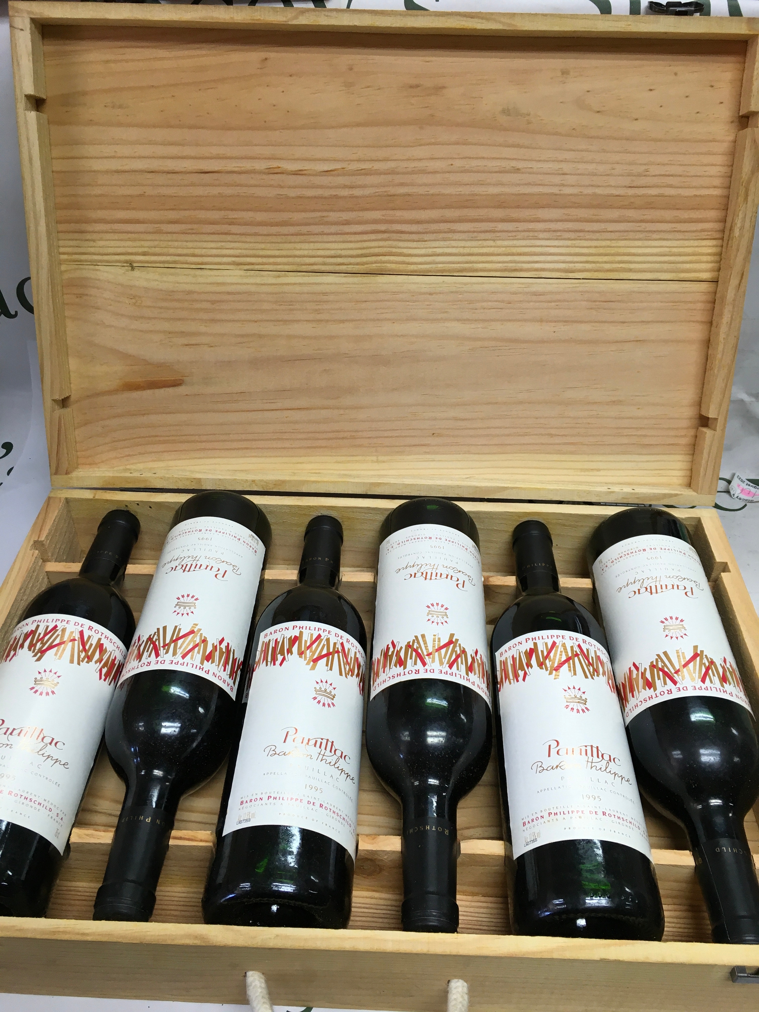 An original 6 bottle wooden presentation case of 1995 Baron Phillipe de Rothschild Pauillac red wine from Bordeaux, France. 