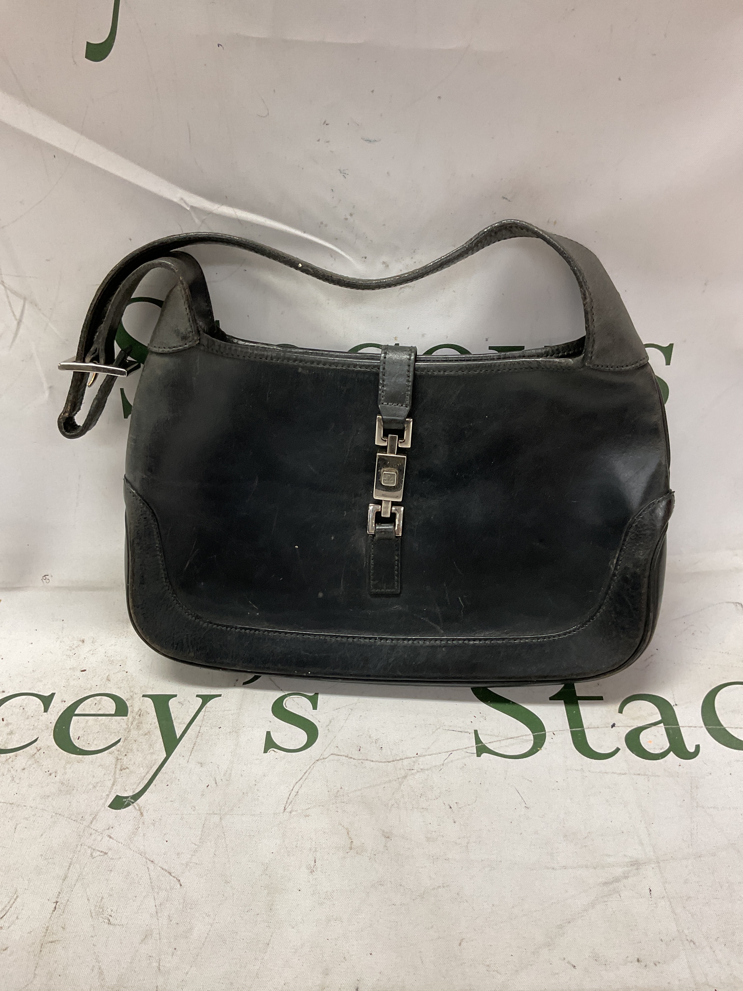 Gucci "Jackie"handbag, black leather with strap.