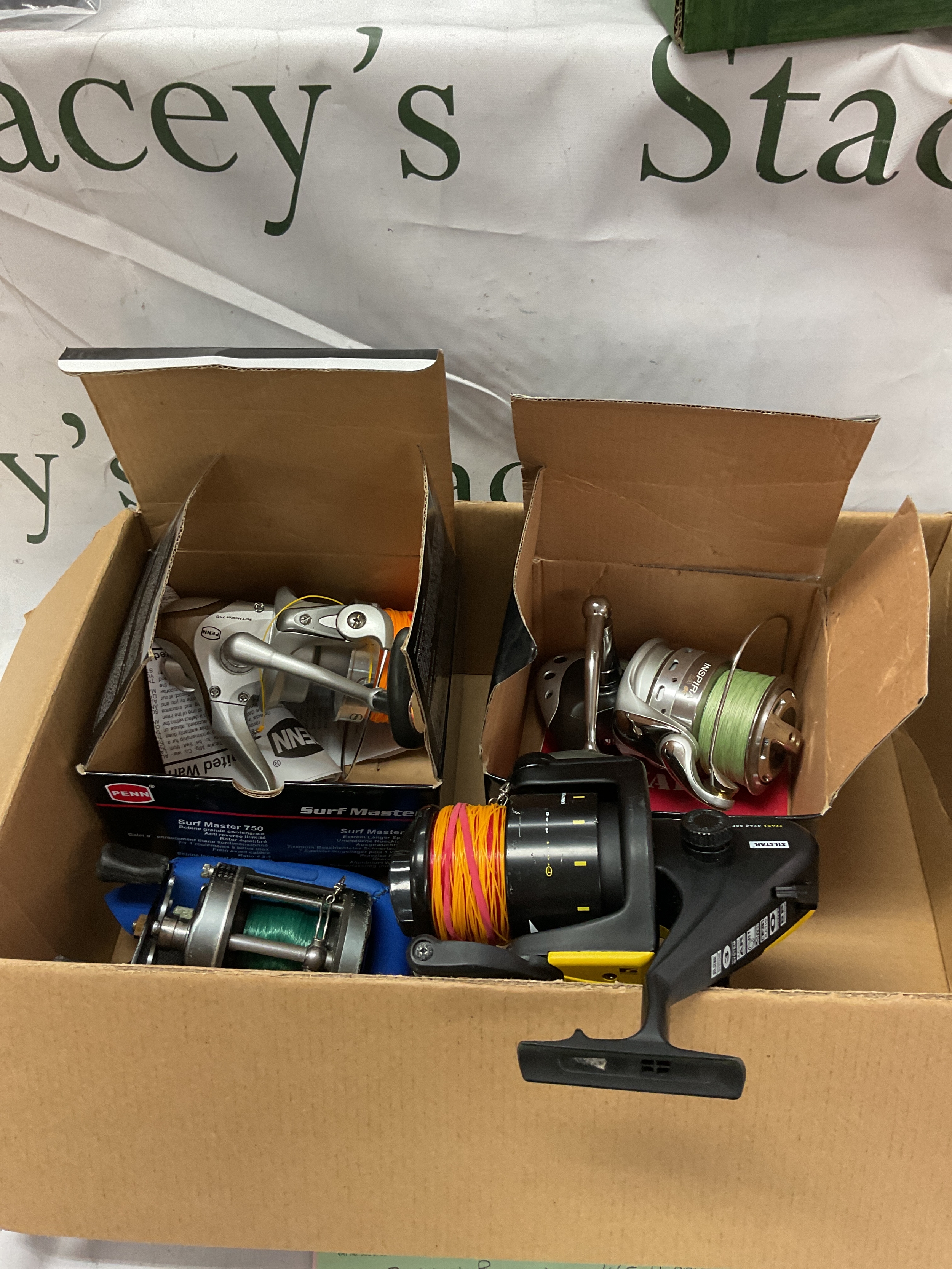 Four fishing reels, Silstar vfs, Daiwa Millionaire, boxed Penn surf master 750 and a boxed Nash Dwarf BP-6.