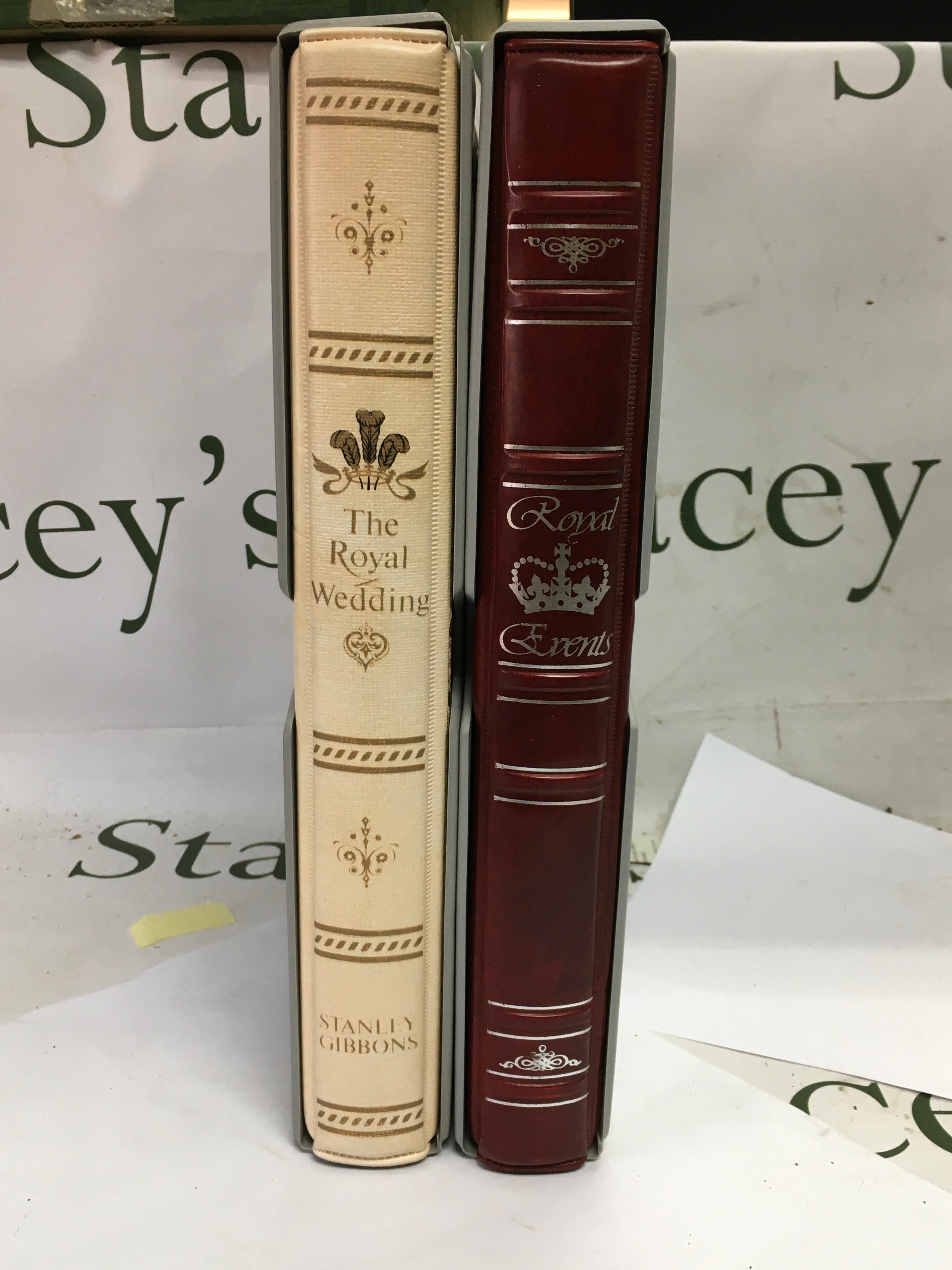 Three Stanley Gibbons stamp albums including 'The Royal Wedding' and two 'Royal Events' albums.