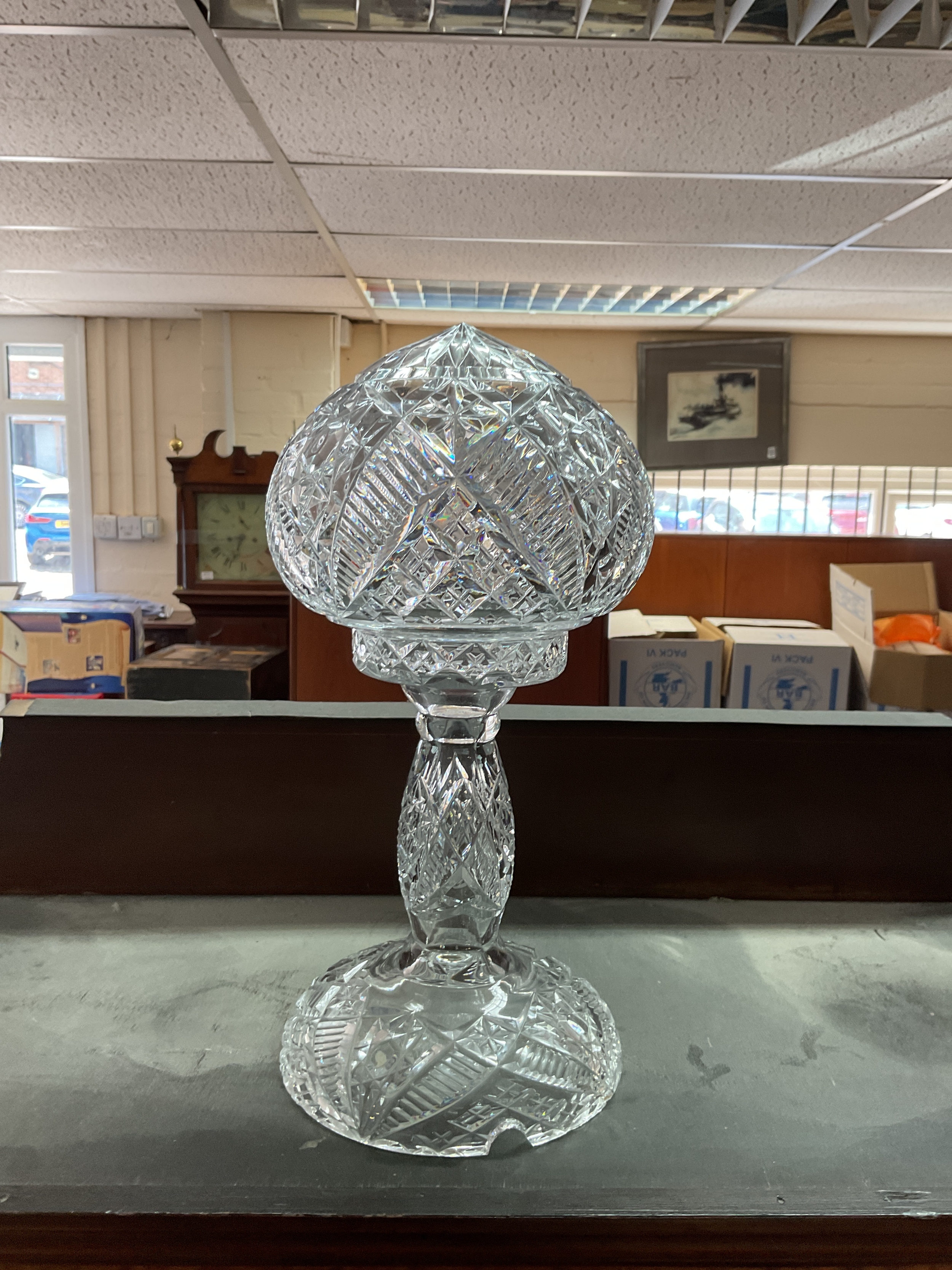 Two piece crystal lamp, with domed top section and heavy baluster form base beautifully crafted in hob nail and high reflective patterns.height 37 cm.