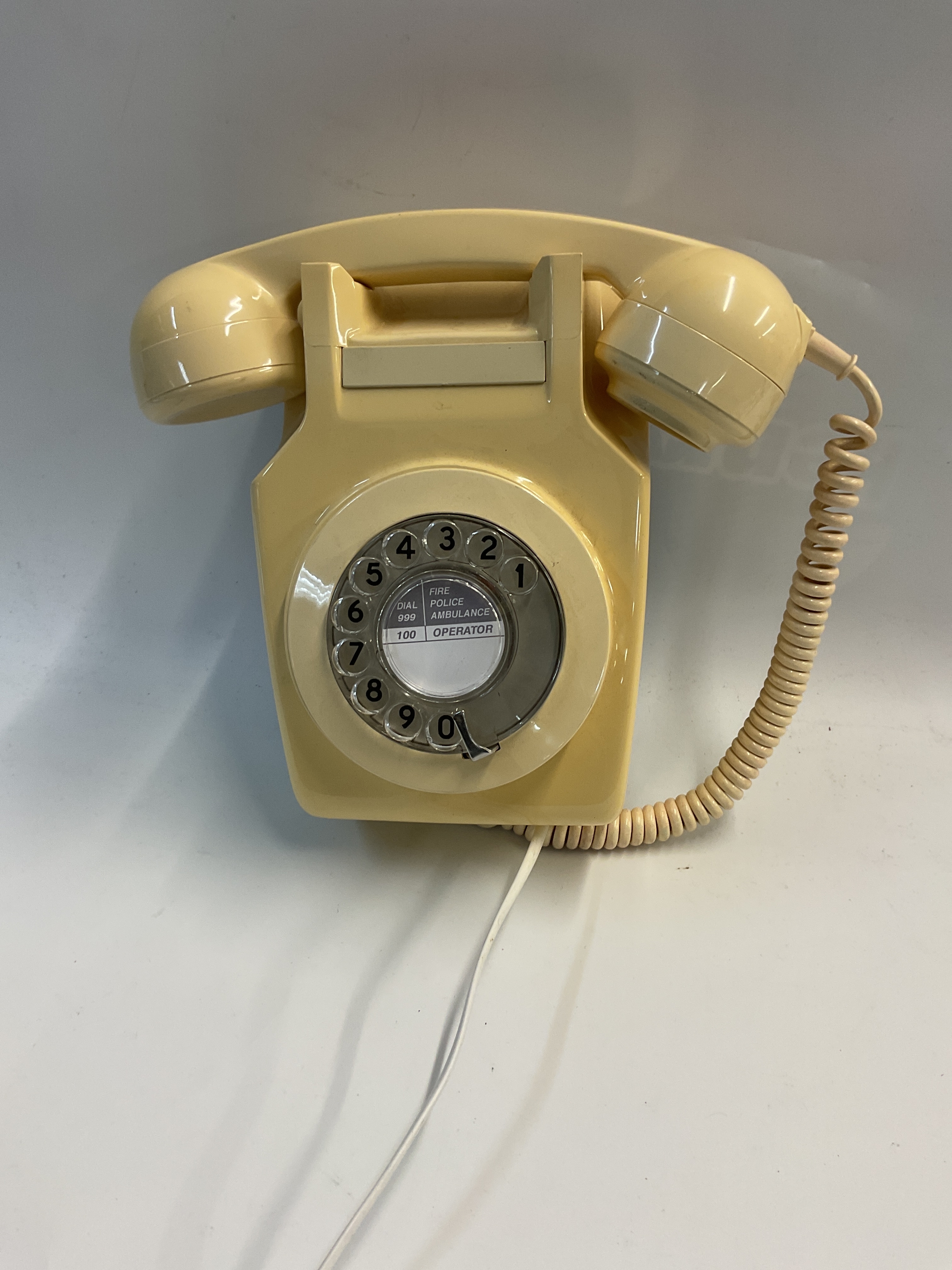 Wall hanging ivory GPO phone.