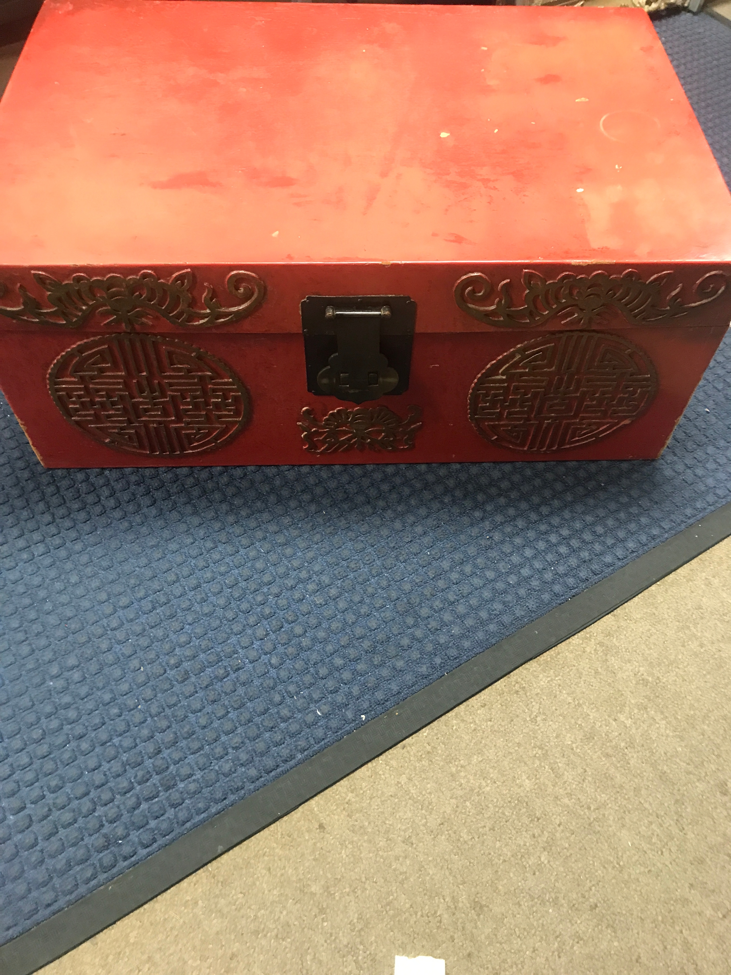 Red lacquer oriental trunk with its brass lock and key