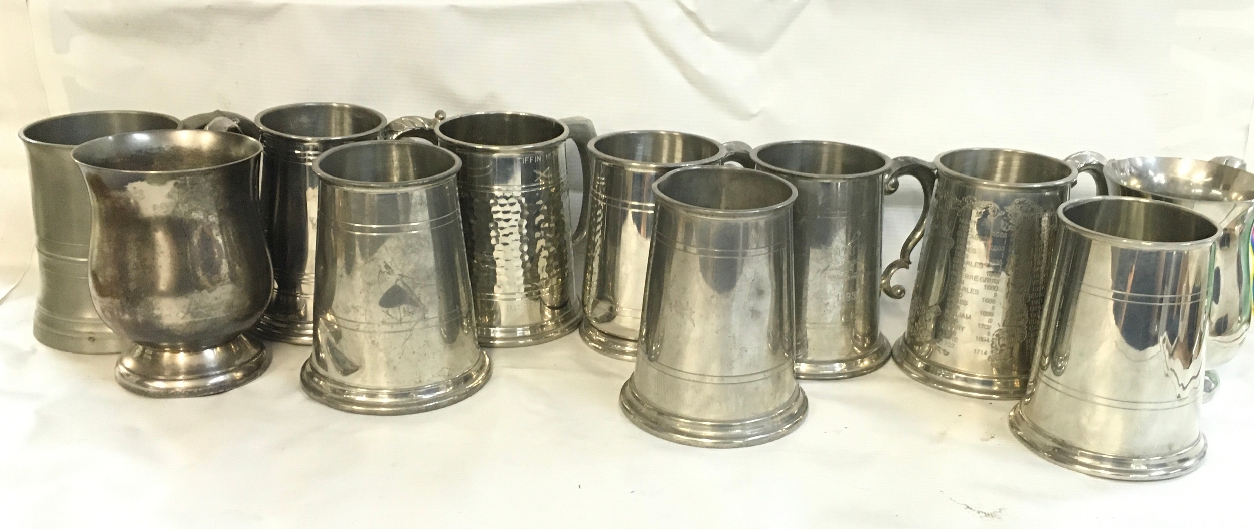 A collection of pewter tankards