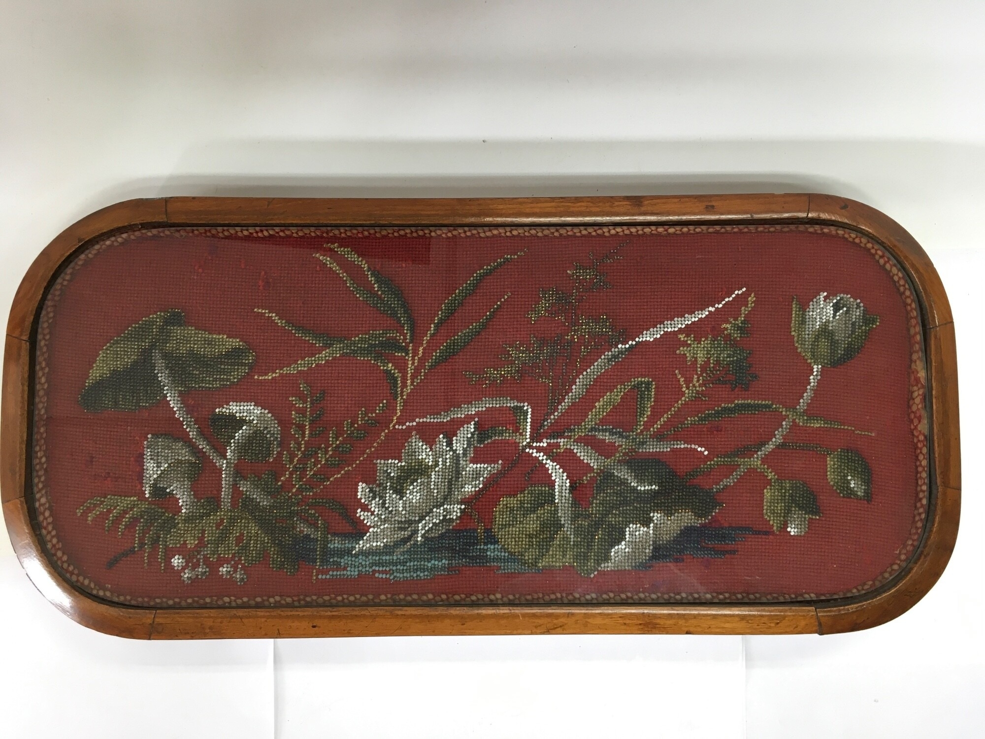 A Victorian beadwork tray housed within a walnut frame, approx width 55cm. NO RESERVE