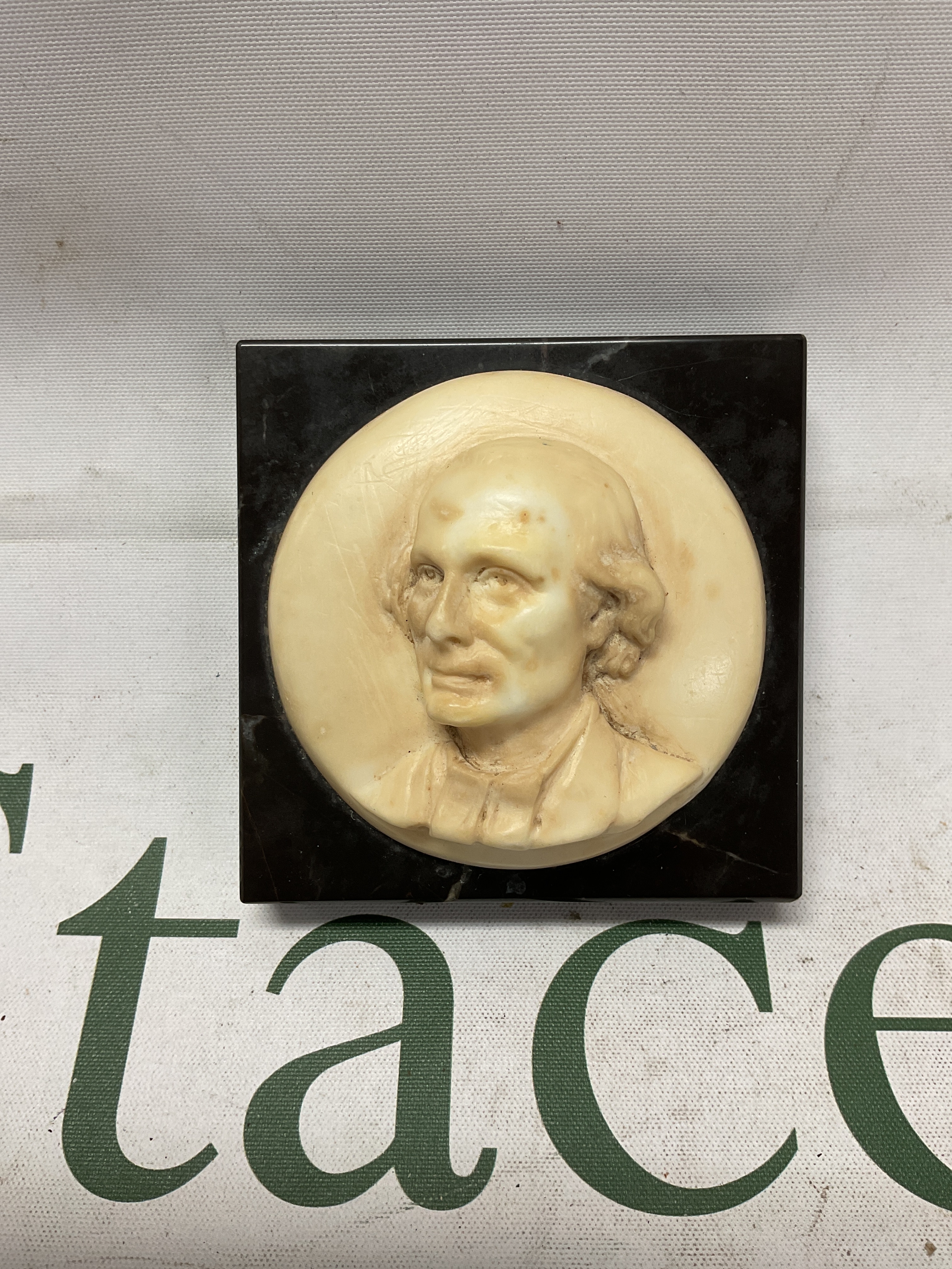 19th C alabaster carved cameo on marble backing, signed to the base " ABartl Petty" 8 cm x 8 cm.