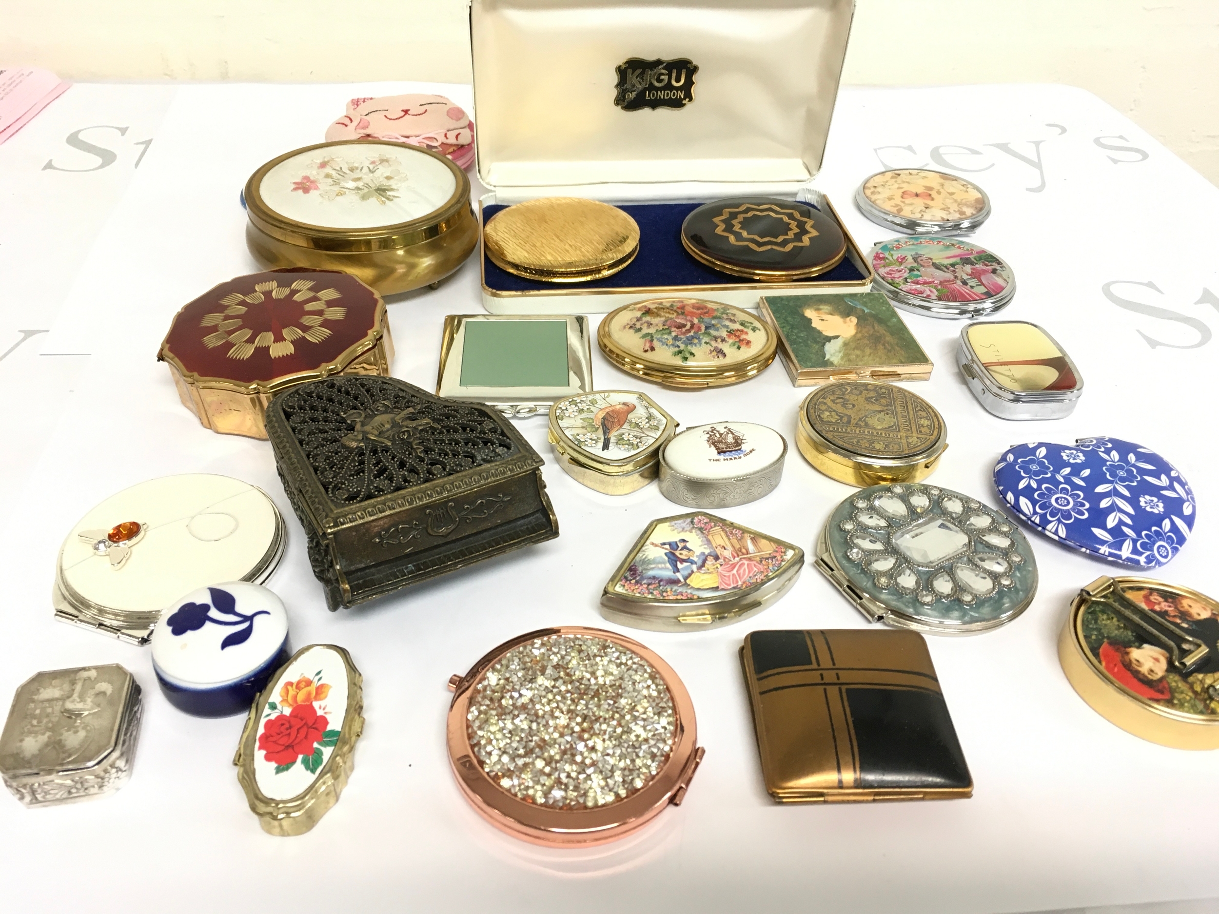 A collection of assorted pill boxes, compact mirrors etc.