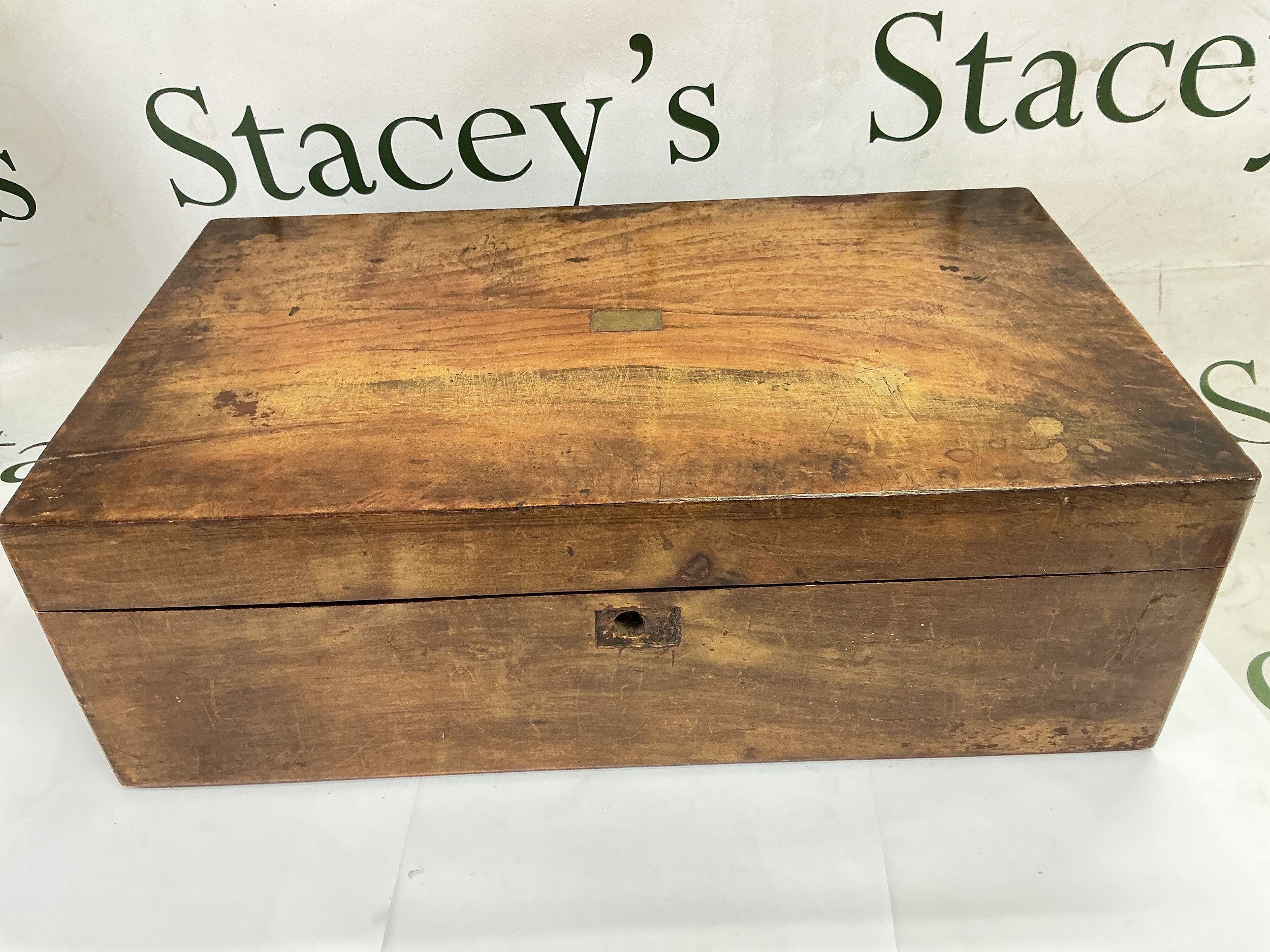 A walnut writing box with a fitted interior.