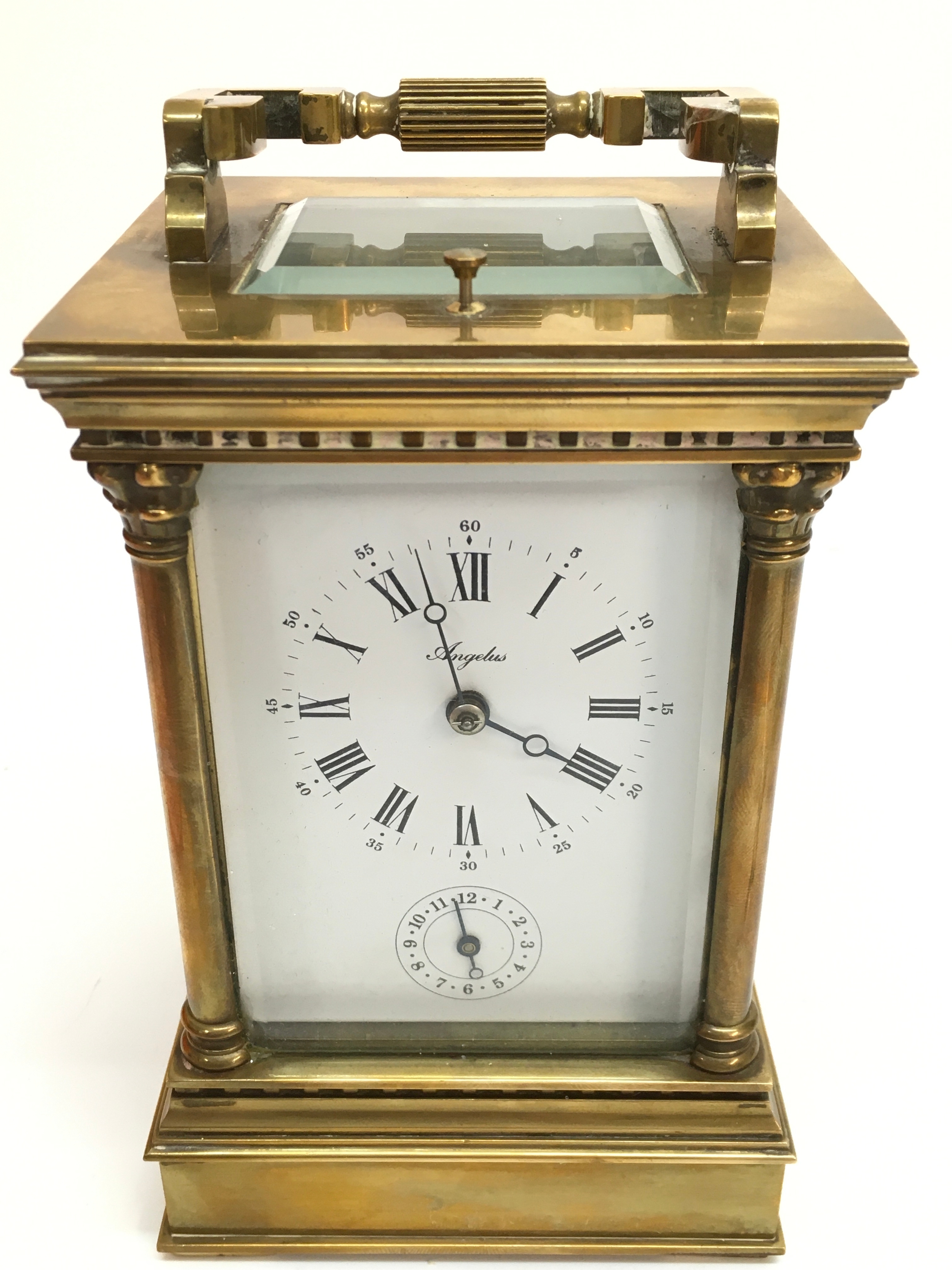 A strike repeat carriage clock, not seen working . 17cm tall, 10cm wide, 9cm long 