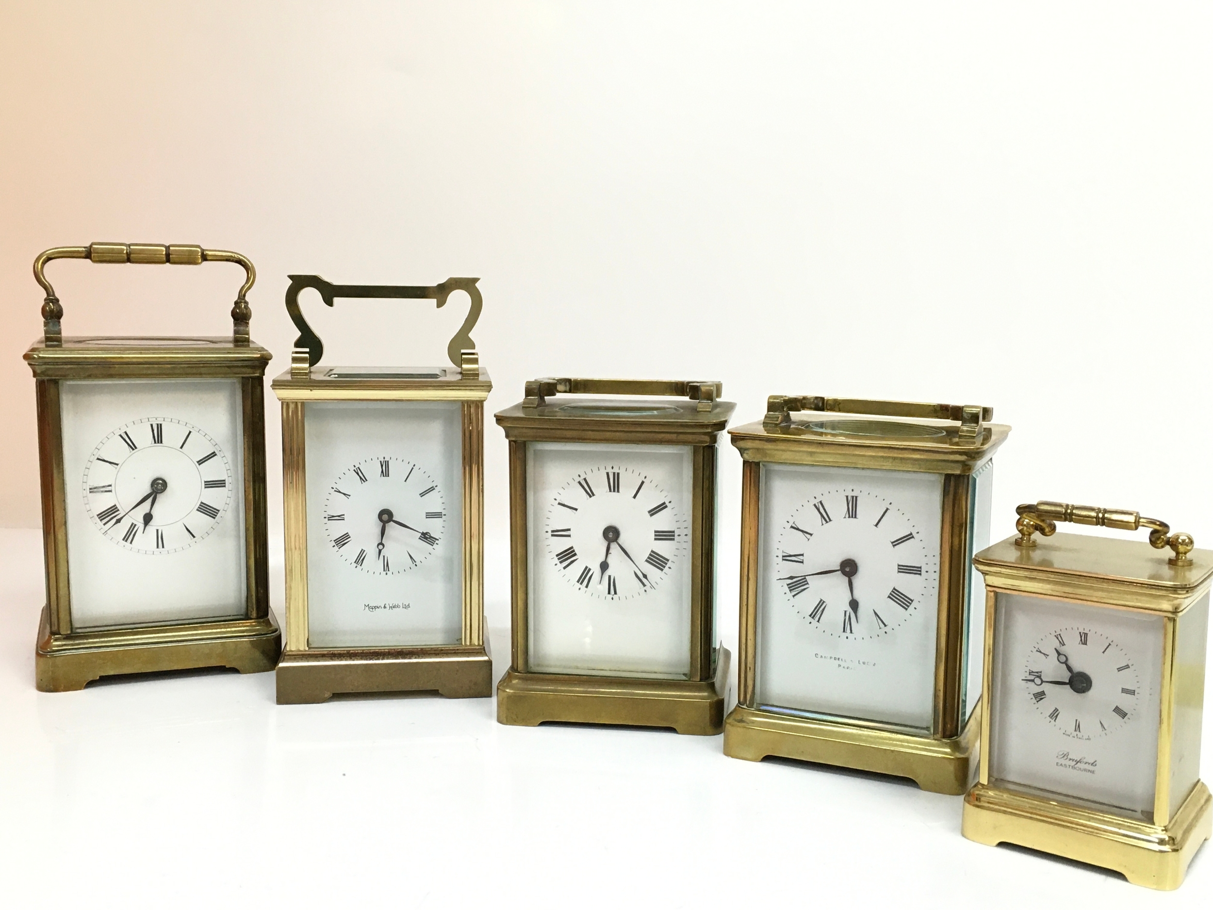 Five carriage clocks (most not working) 8 to 13cm tall