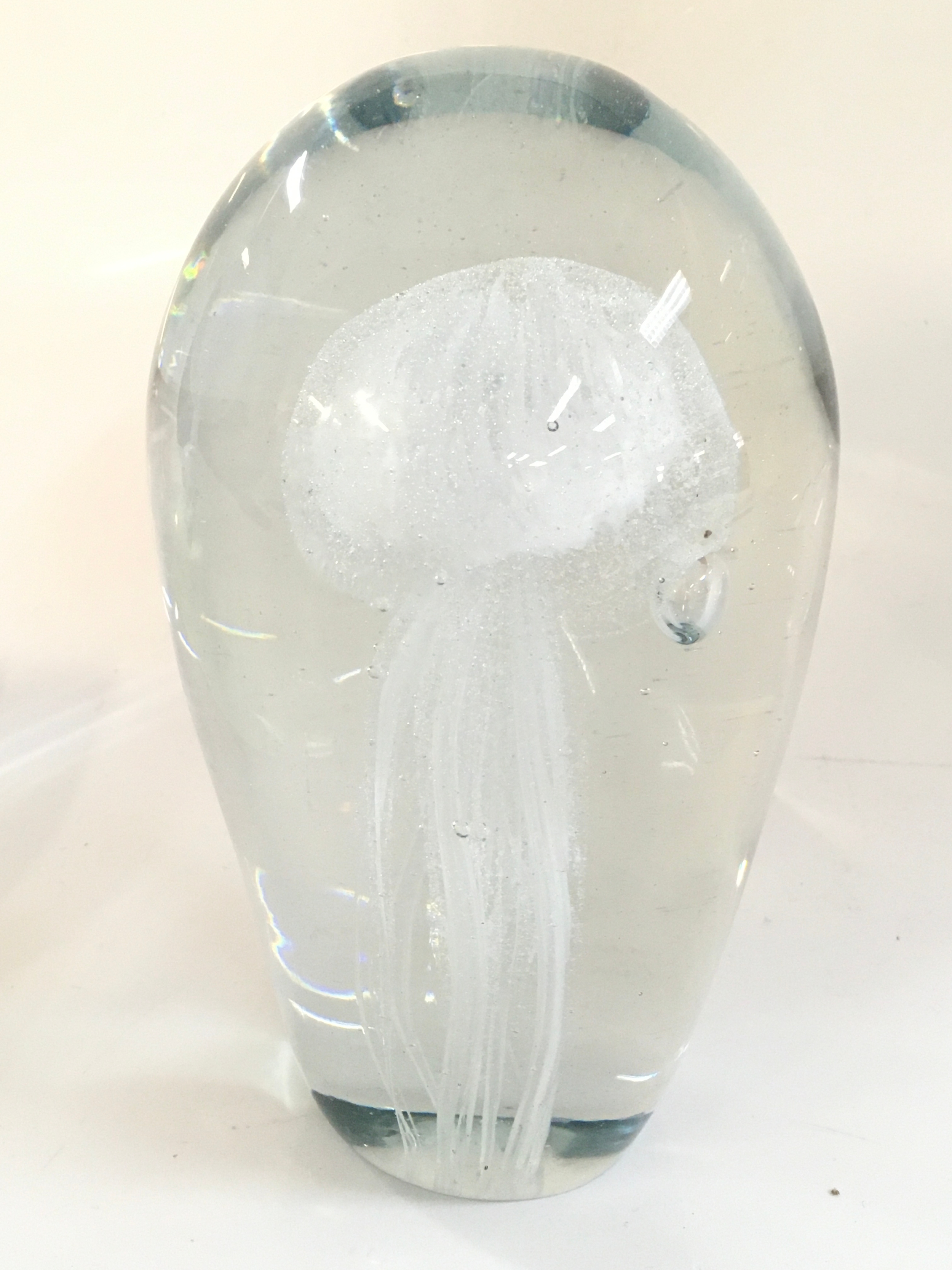 A glass jellyfish paperweight. 18cm tall