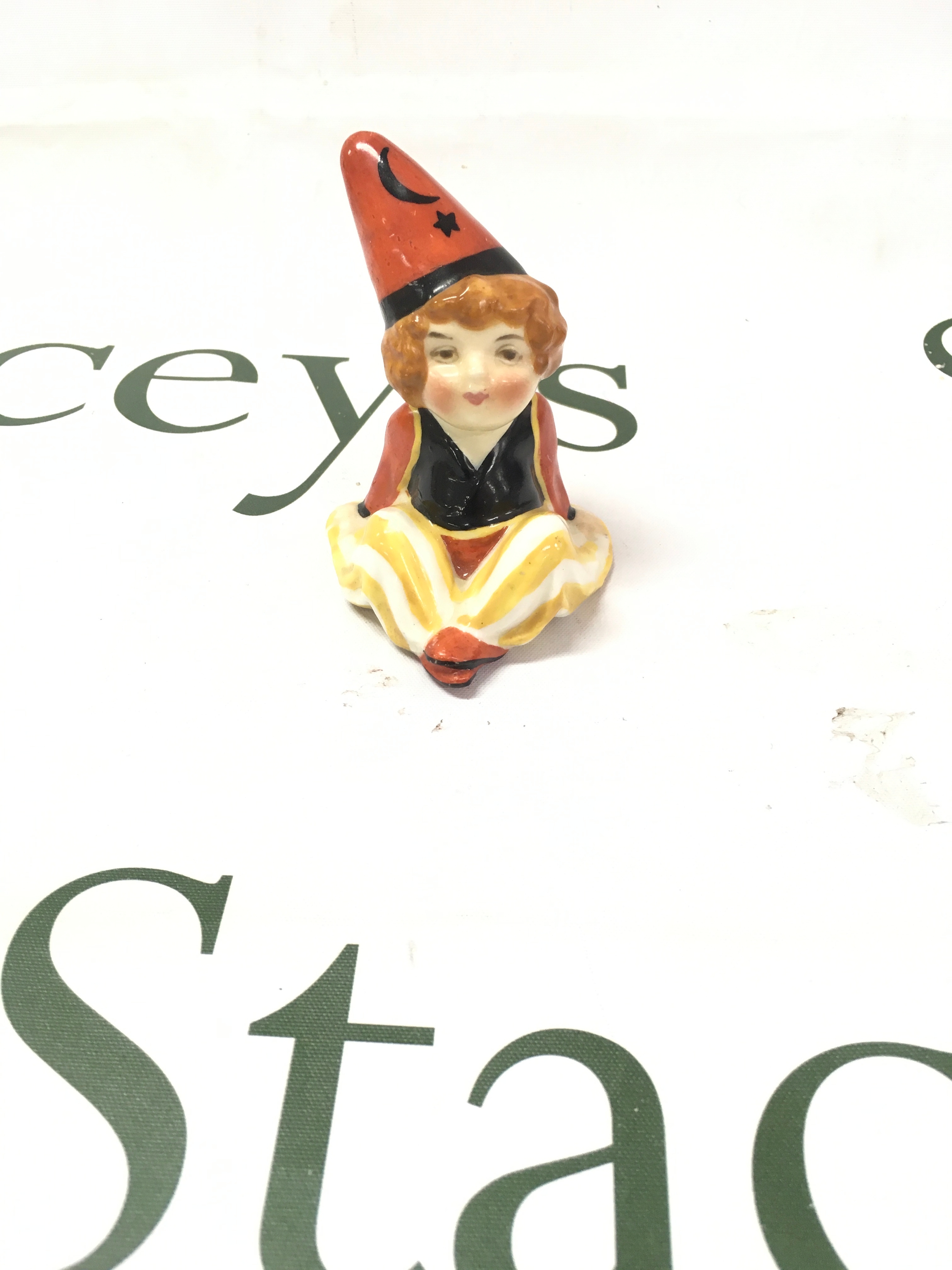 A rare Royal Doulton "Cassim" figurine (HN1232), designed by Leslie Harradine and produced between 1927 and 1938, 8cm tall