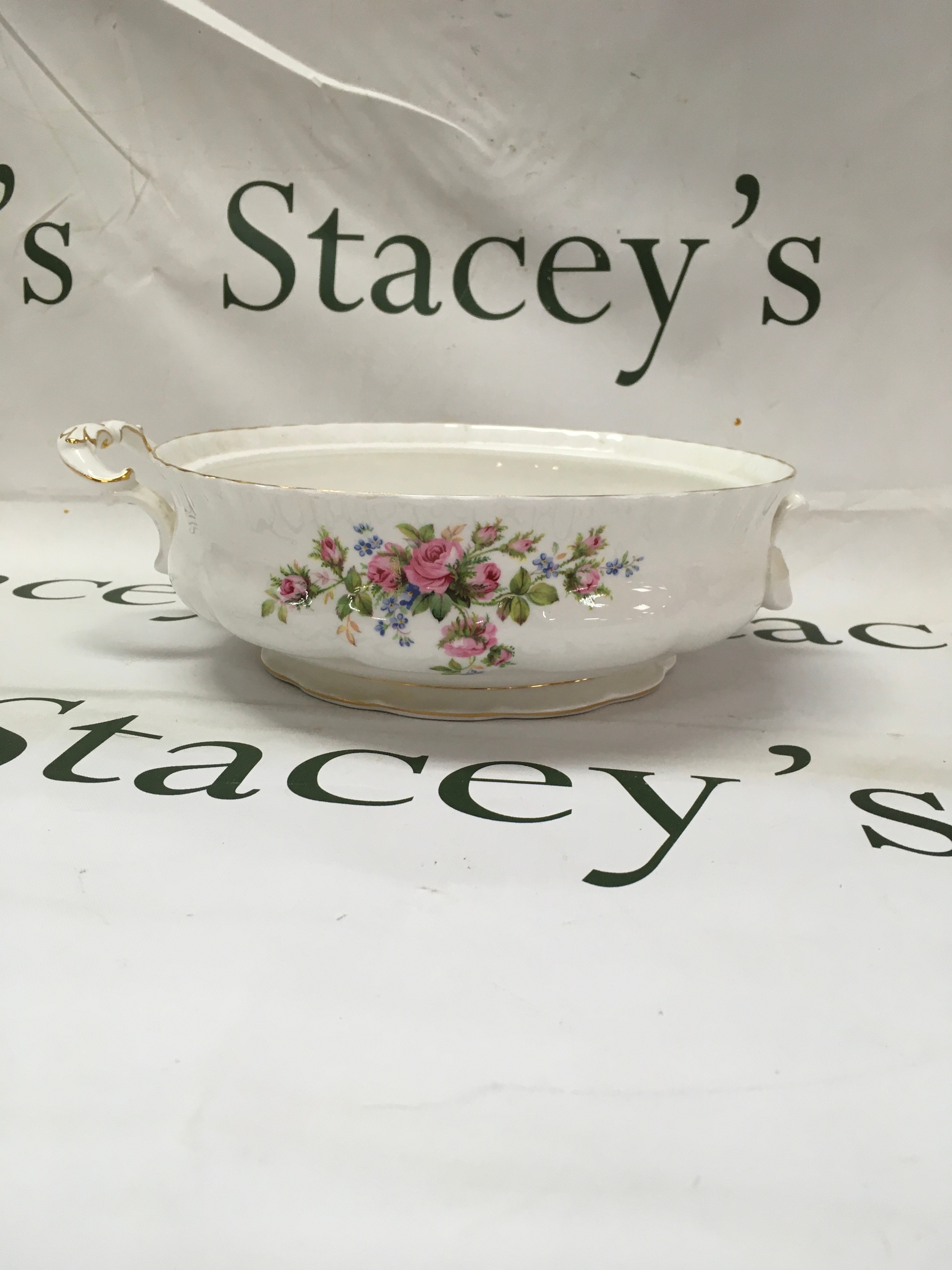 Mixed collection of Spanish porcelain and British fine bone China. Including a royal Albert "old country roses" open vegetable bowl. A Lladro owl figure, a nasal model #2537 "boy with geese", Coalport "ladies of fashion" small figurine, crown Dorset cup and royal Albert saucer.