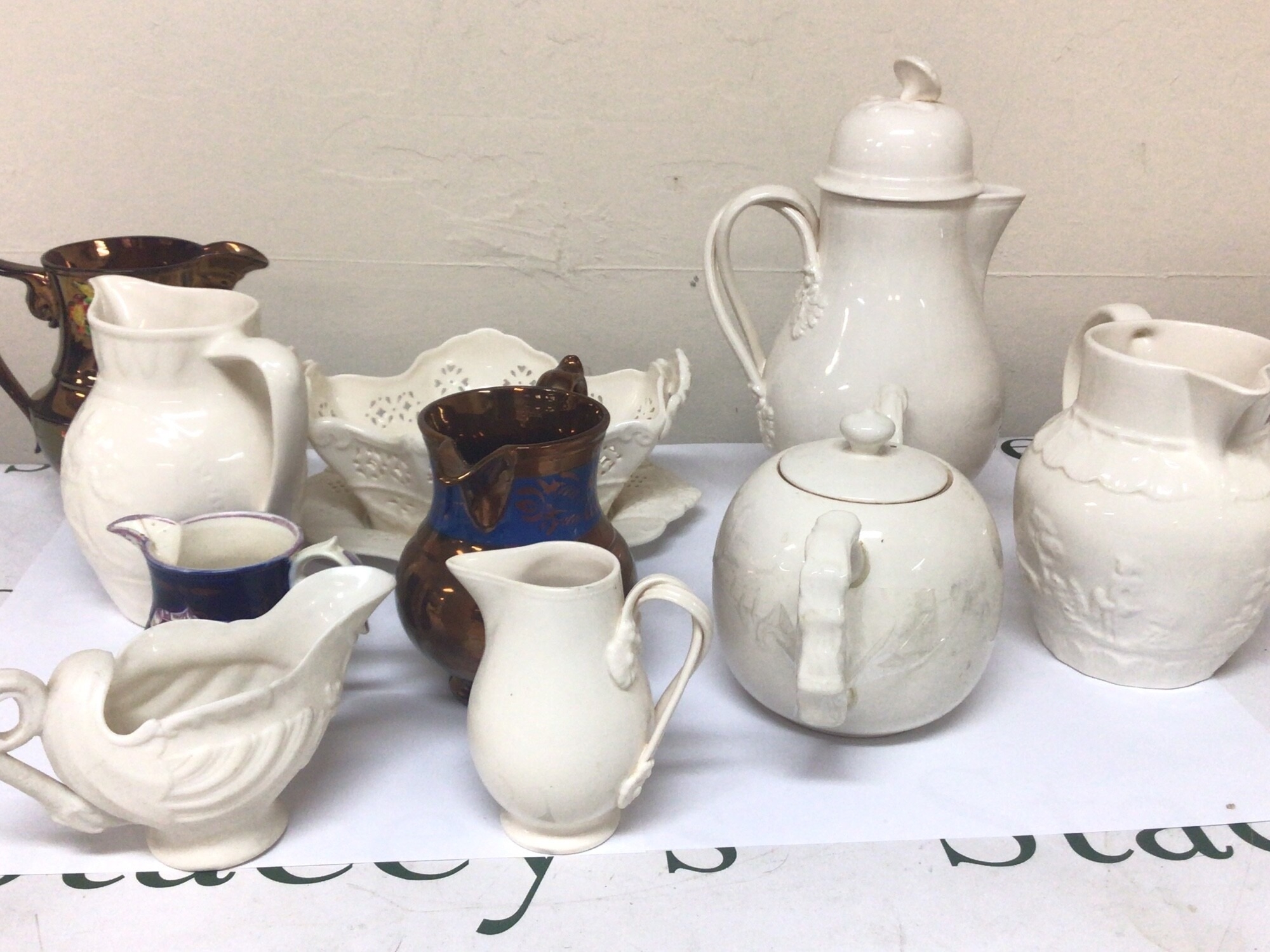 A collection of late 19th century lustre jugs and 20th century Hartley Greens Leeds creamware ceramics (a lot)