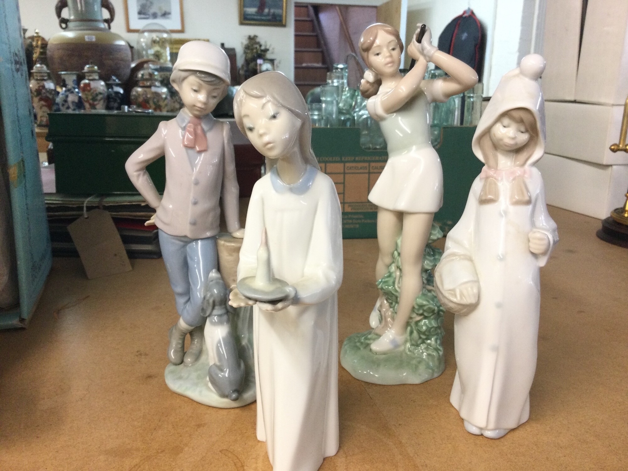 Four Lladro and Nao figures NO RESERVE