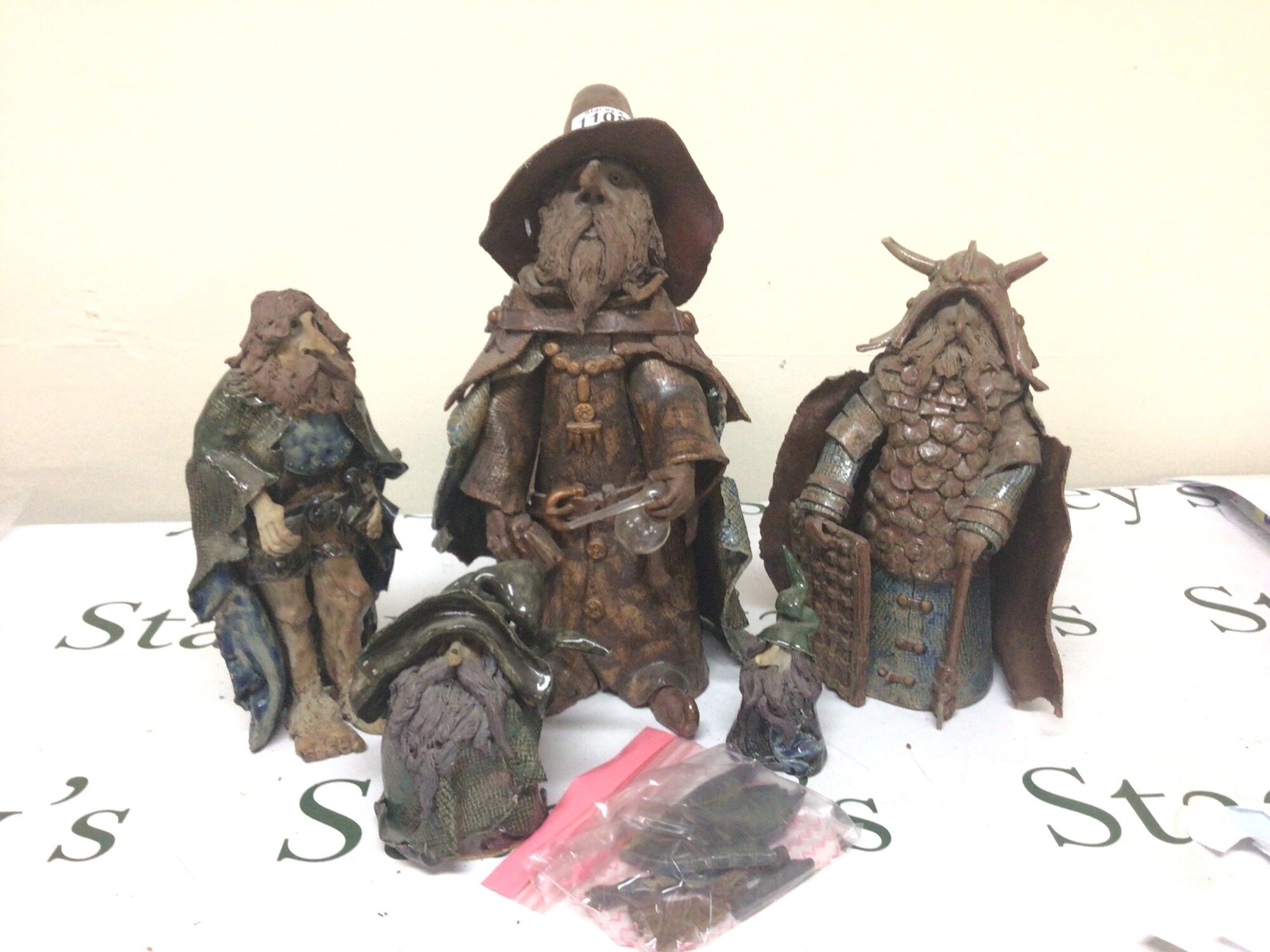 A collection of Vintage Clare Craft glazed ceramic figures of Wizards hight 38cm and associated figures the large Wizard holding a glass alchemist flask this figure having no obvious damage with other figures some with loose parts NO RESERVE