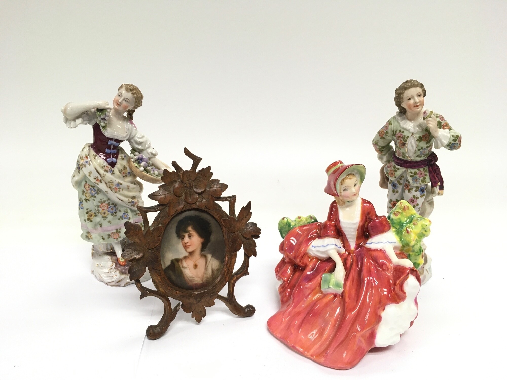 A Royal Doulton figure, Lydia HN1908, two small German porcelain figures and a late 19th Century Austrian portrait on enamel, tallest approx 15cm (4). NO RESERVE