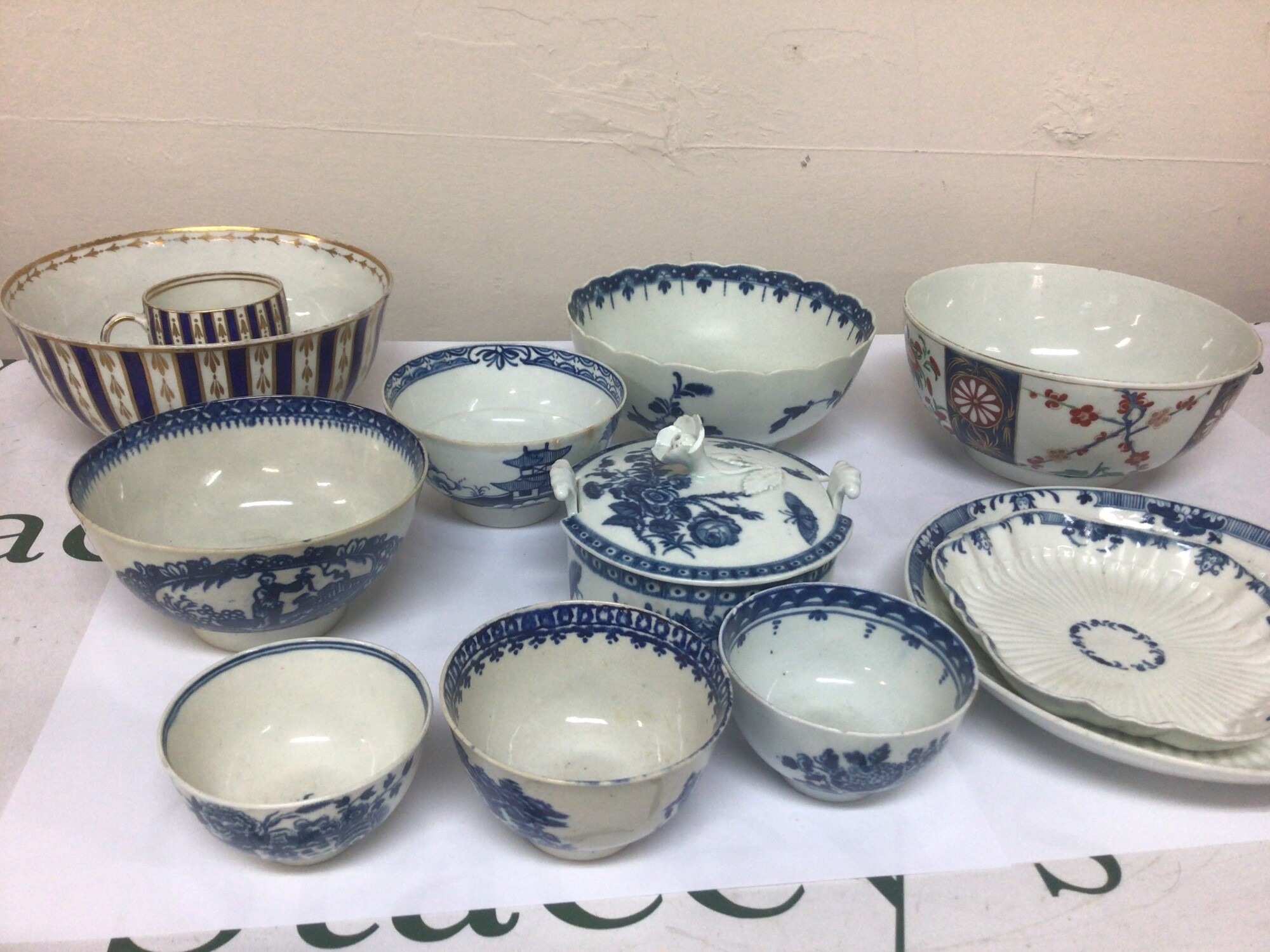 A collection of 18th century Worcester and other porcelain including a butter dish bowls included one decorated in a European taste with blue and gilt c1780 some hairline cracks. NO RESERVE
