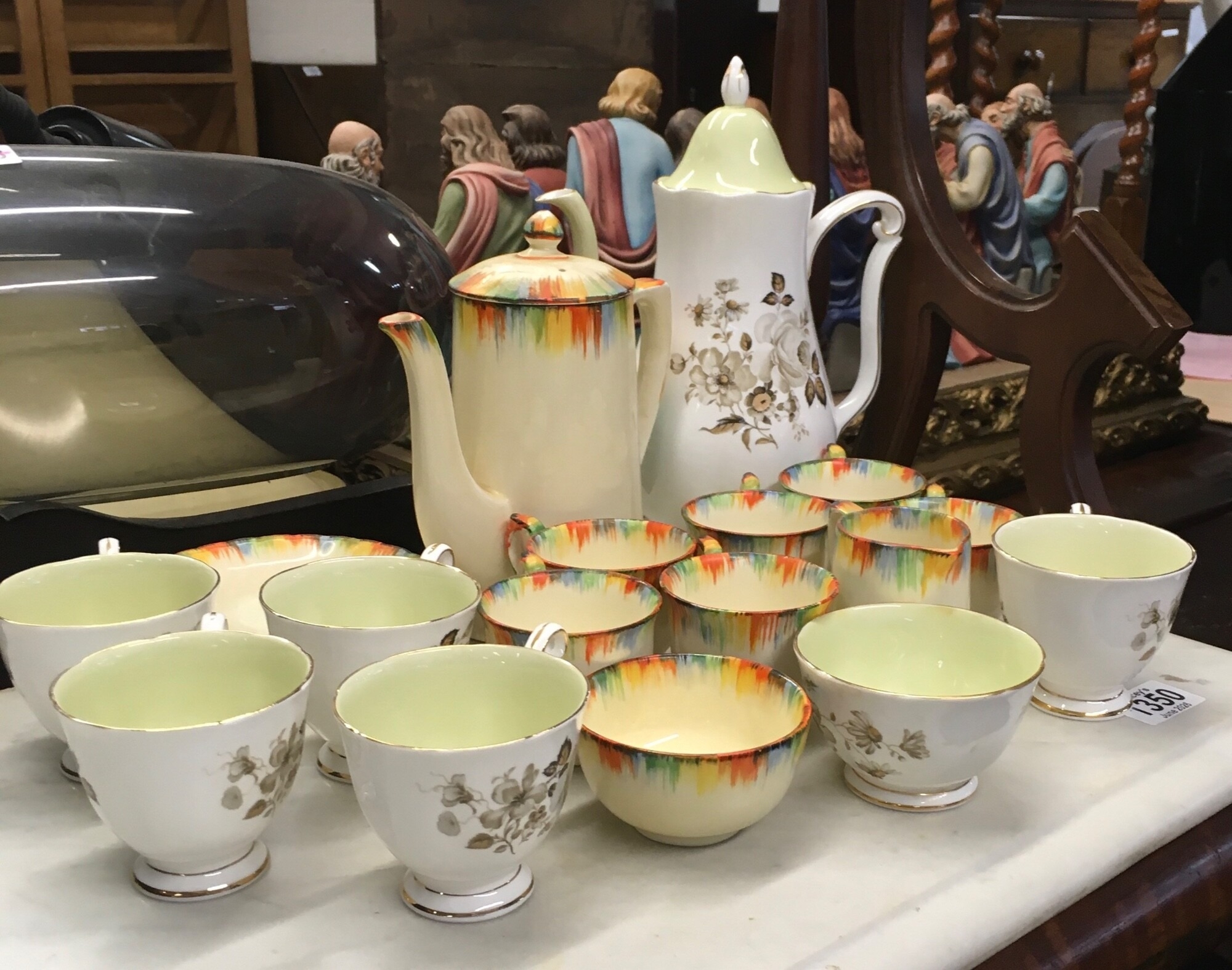 A classic piece of British Art Deco pottery, the items consist of a multi coloured splash effect around the rims using vivid colours and the interior of the cups feature a solid, pale glaze. NO RESERVE