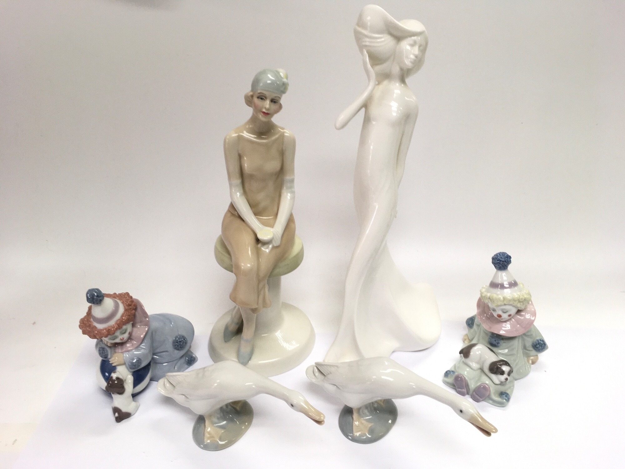Six Lladro and Royal Doulton figures comprising Cocktails HN3070, two Lladro clowns etc. NO RESERVE