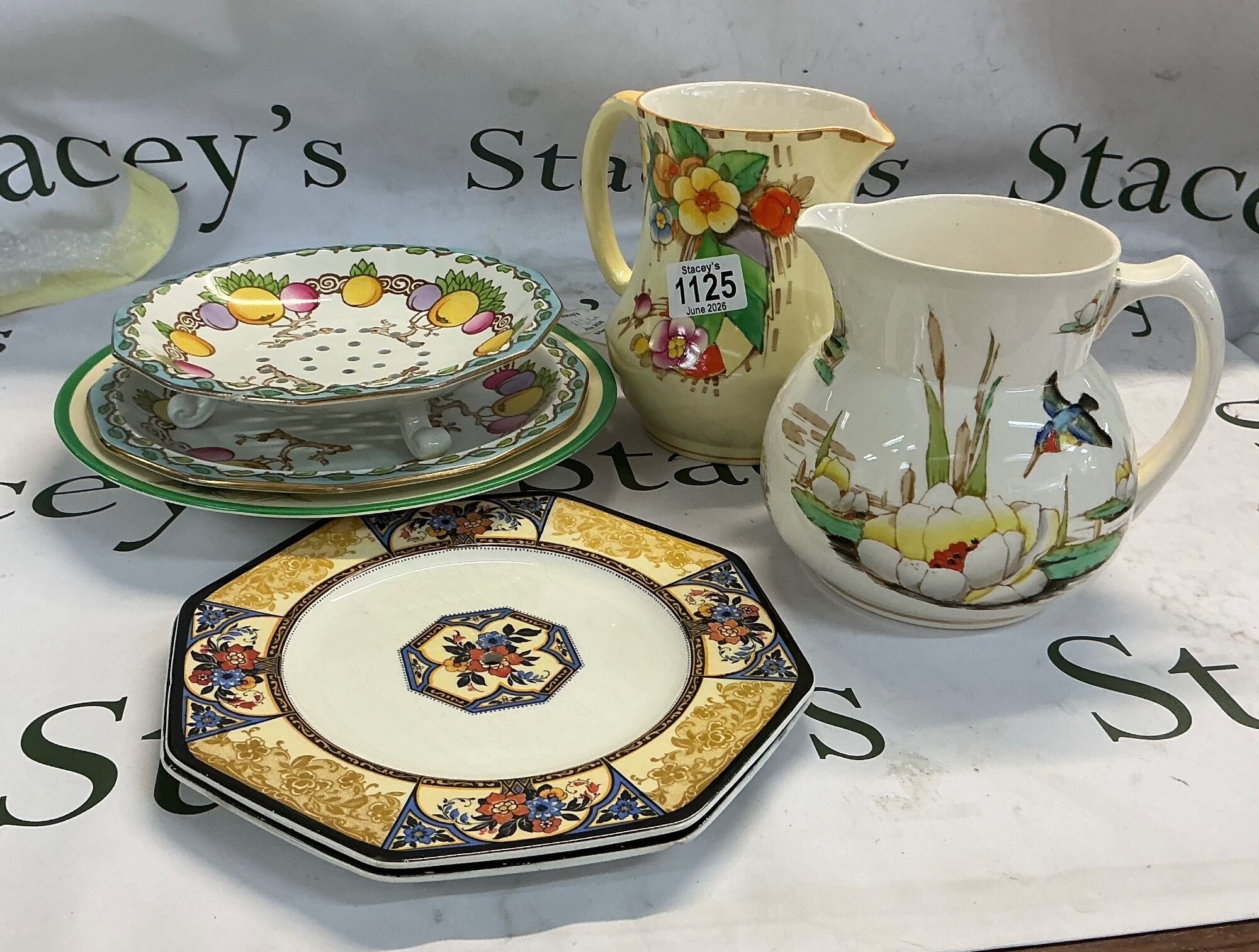 A collection of differently designed ceramics pottery and tableware. Some of the pieces are designed in the Art Deco tradition and some others consist of a more traditional Chinoiserie pattern. In the collection there is 3 plates, 1 bowl, 1 risen plate and two jugs with unique patterns NO RESERVE