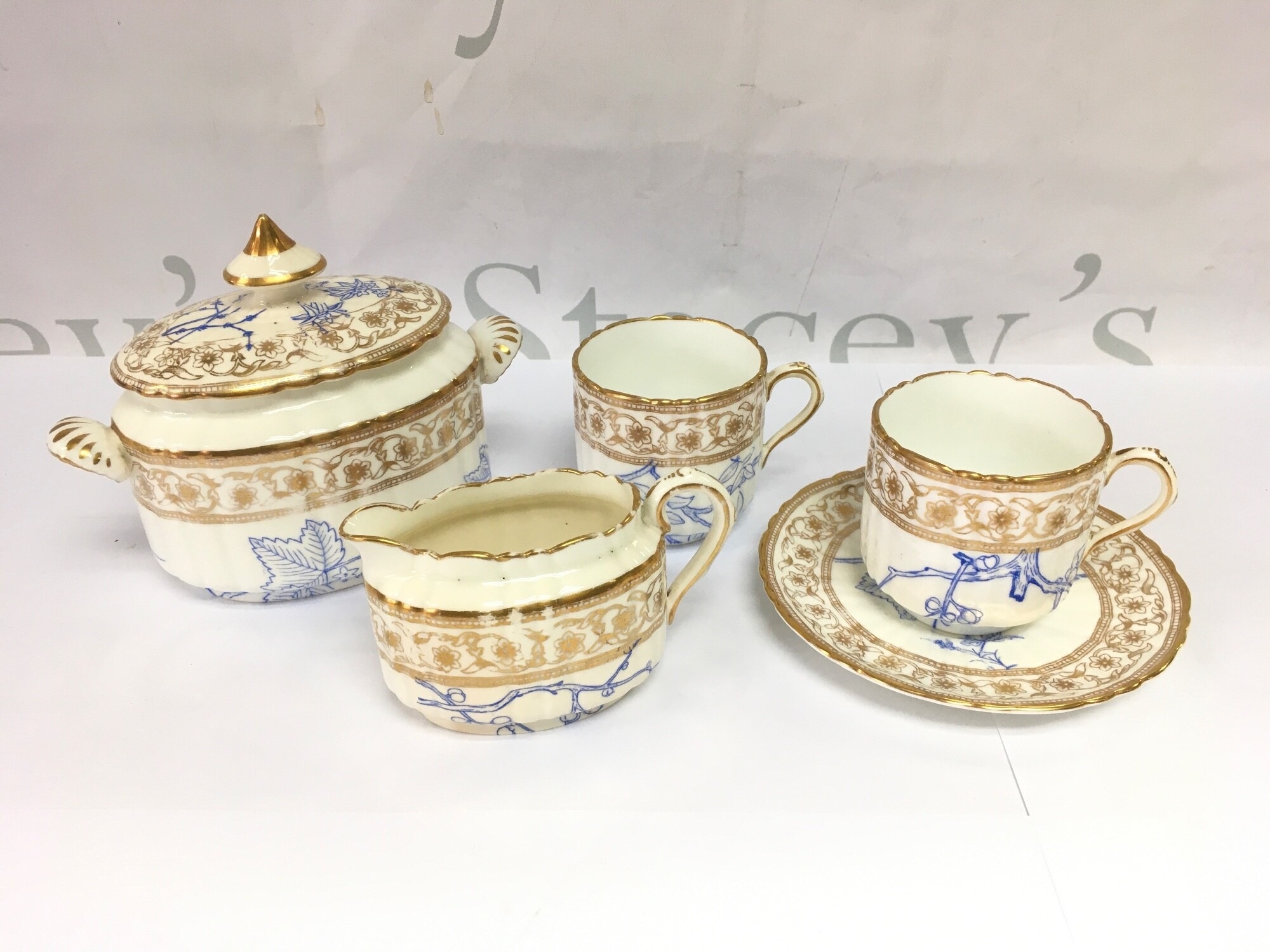 An Edwardian six piece blue, white and gilt coffee set. NO RESERVE