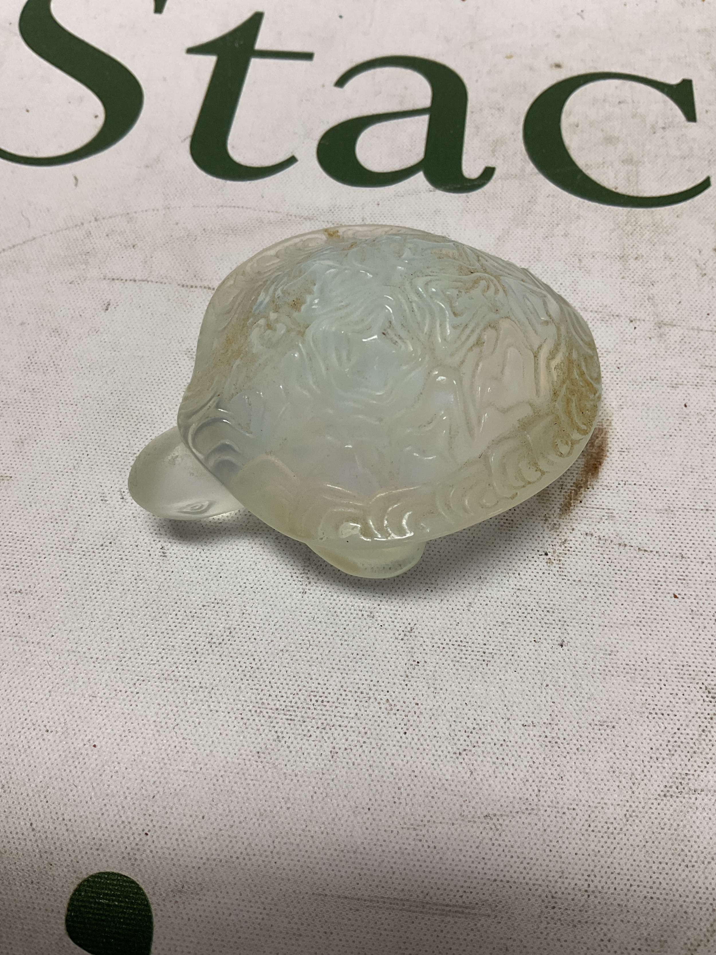 Lalique small tortoise with some iridescence, signed to the base Lalique, France. 8cm.
