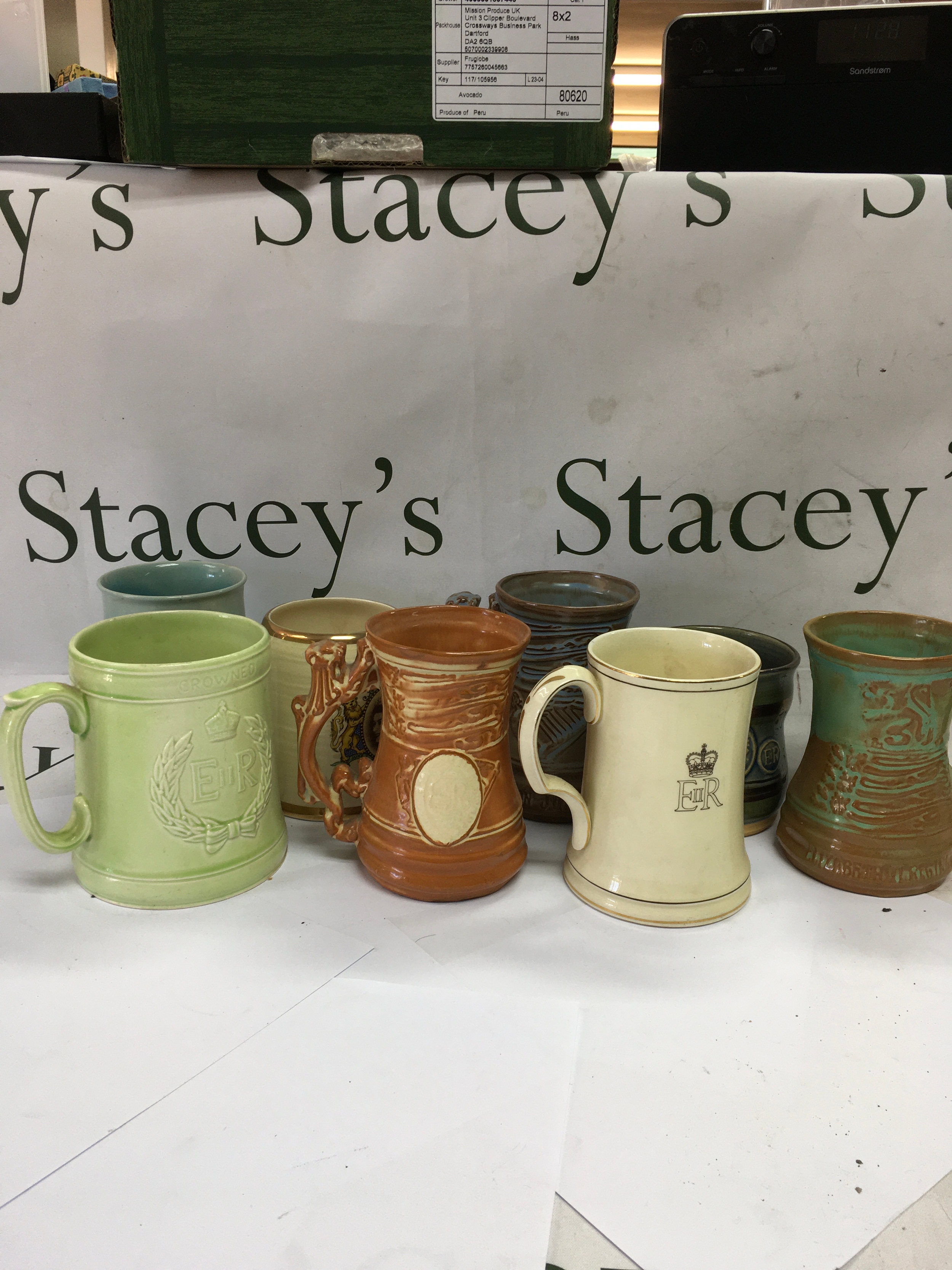 A collection of vintage British Royal Commemorative ceramic mugs and tankards.