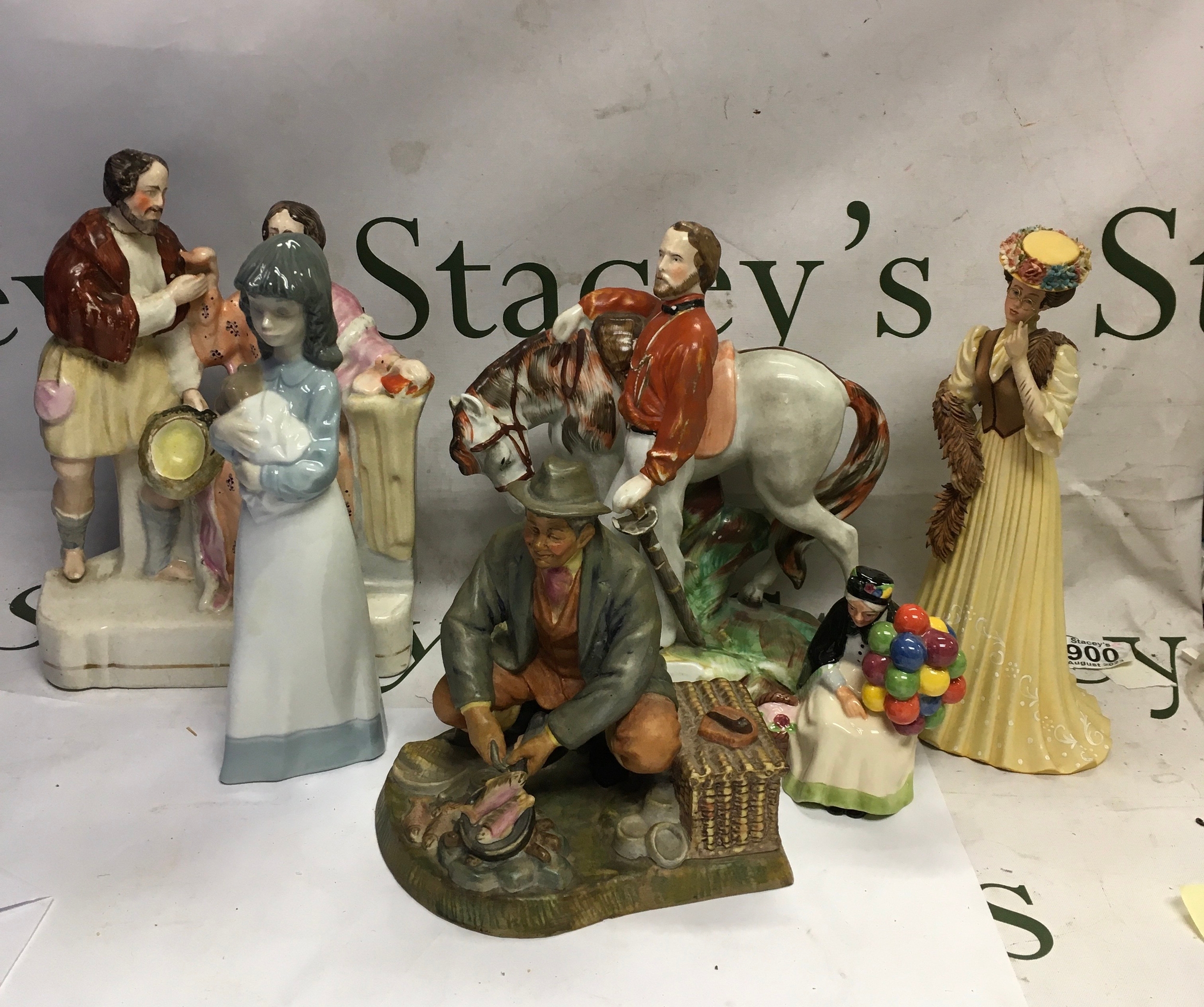 A collection of vintage fine porcelain and ceramic figurines. 