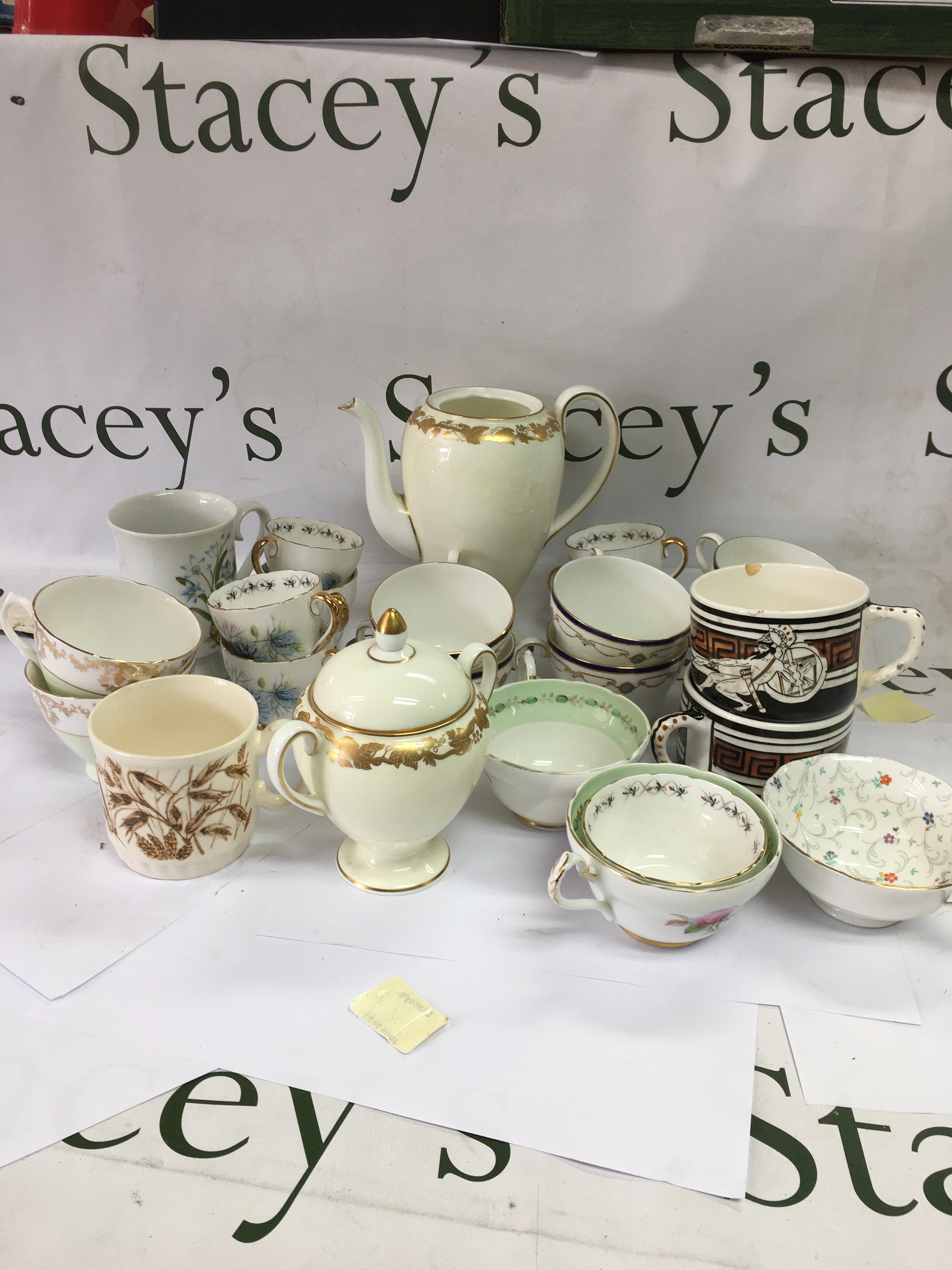 A mixed collection of decorative ceramic tea pots and jugs. 
