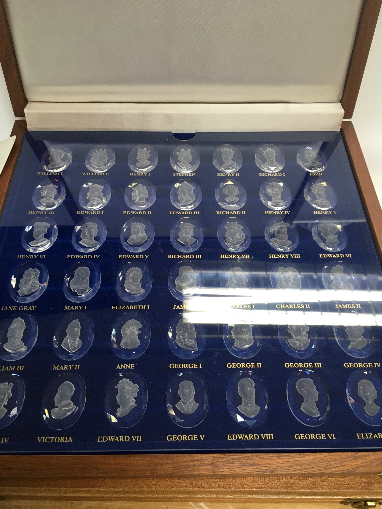 A mixed lot of two boxes of royal crystal cameos aswell as metal and crystal figures. NO RESERVE