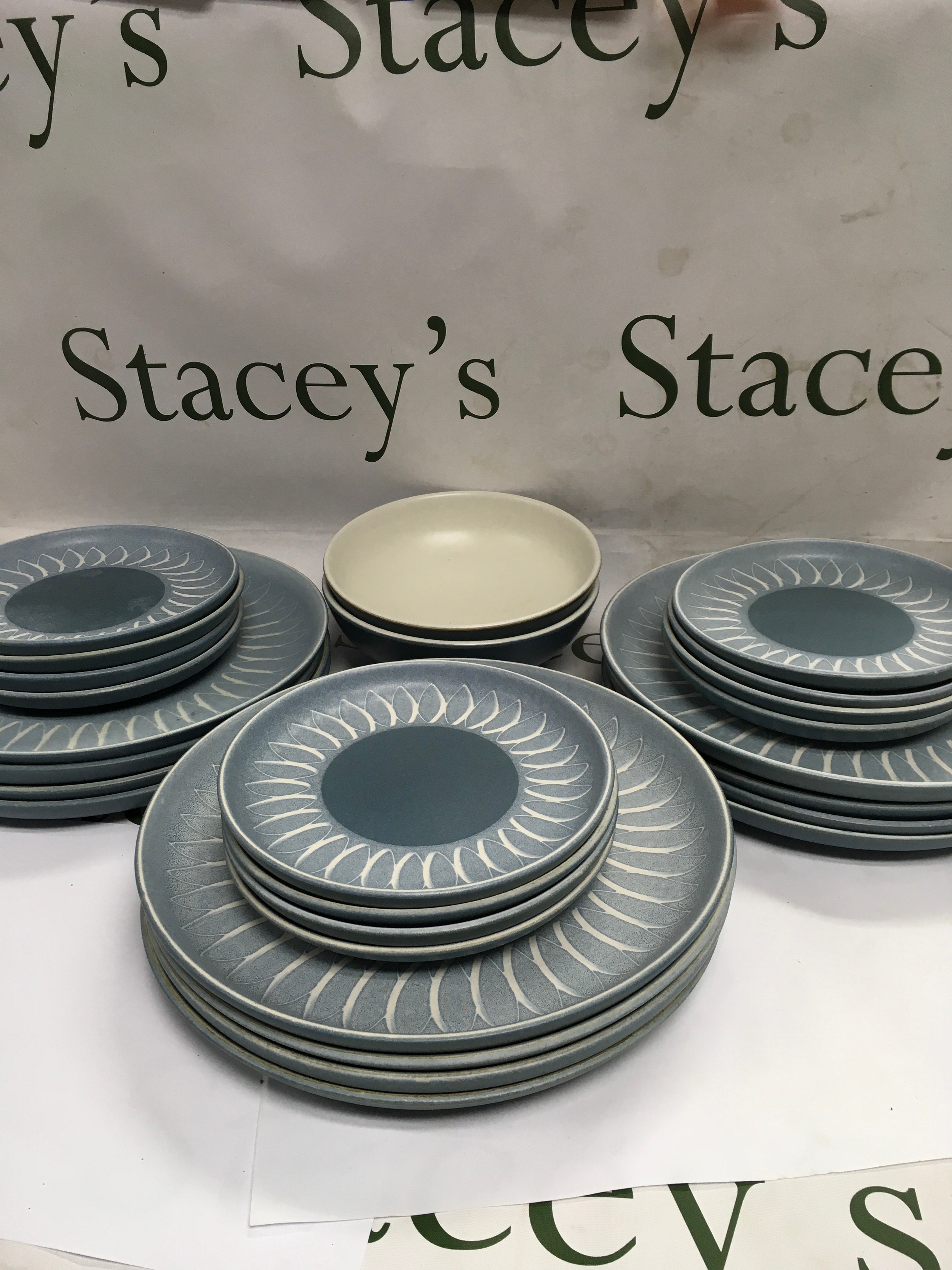 A collection of Denby Echo Blue plates and bowls 