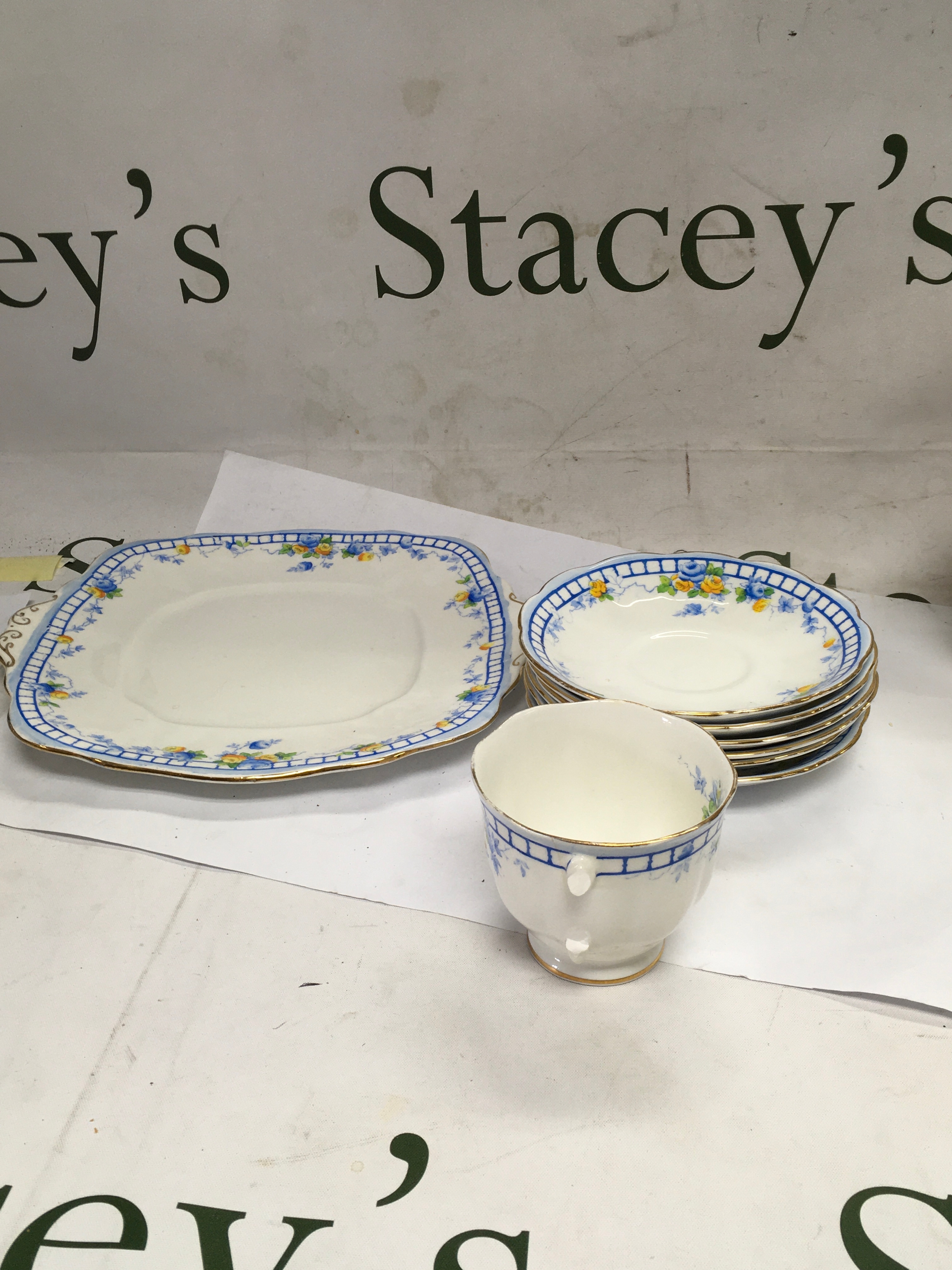 Small Royal Albert tea service with a blue rose design.  